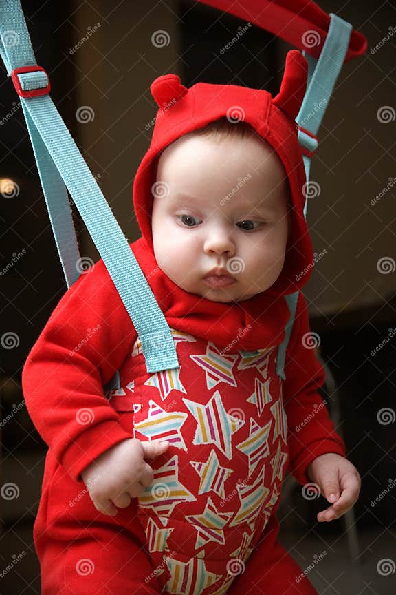Baby in the jumper stock photo. Image of horns, active 14138746