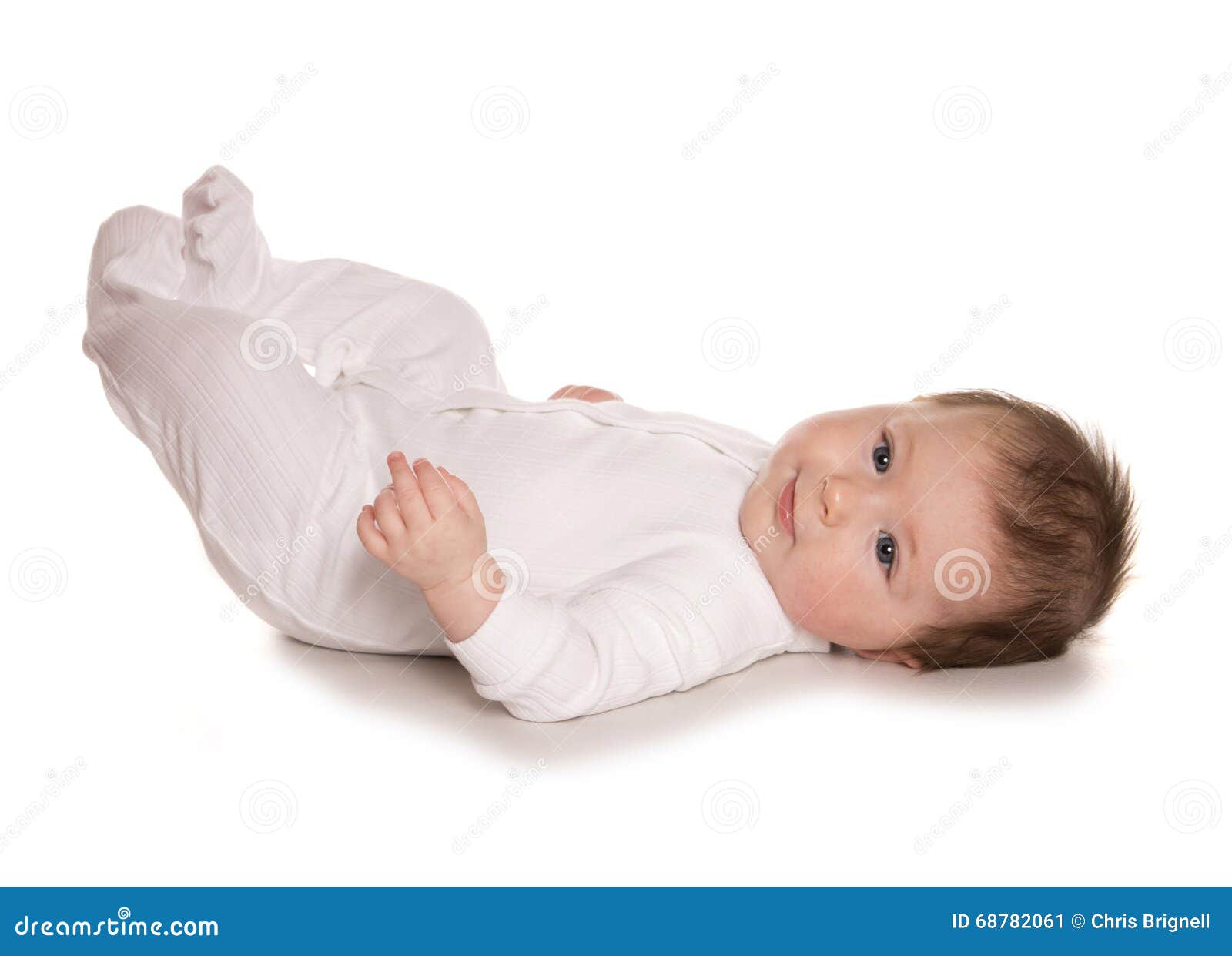 Baby kicking feet stock image. Image of milestones, roll 68782061