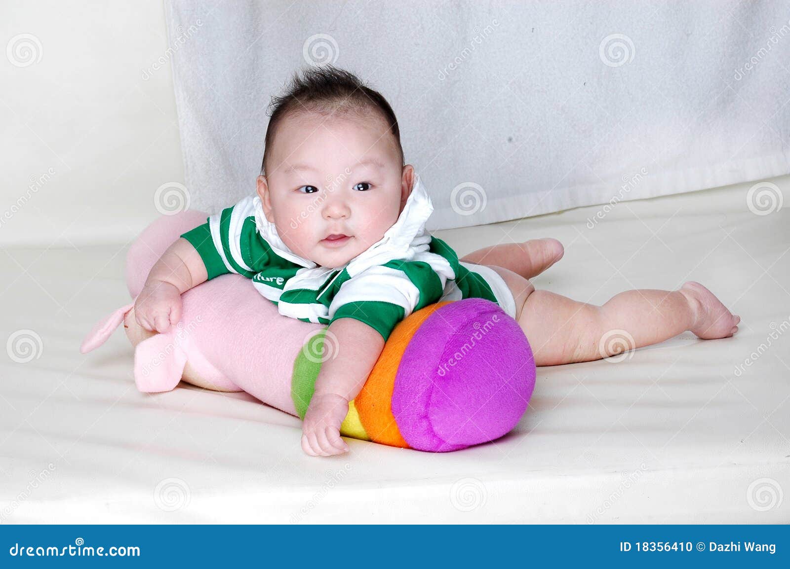 Baby laying on a pillow stock photo. Image of asian, attractive 18356410
