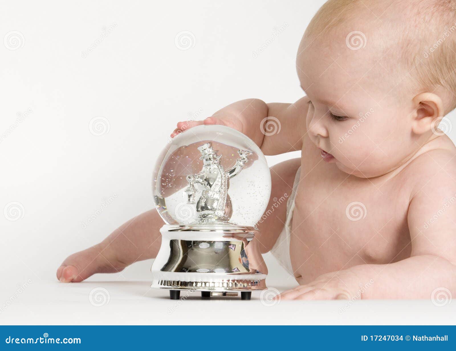 Baby Looking at Snow Globe stock photo. Image of curious 17247034