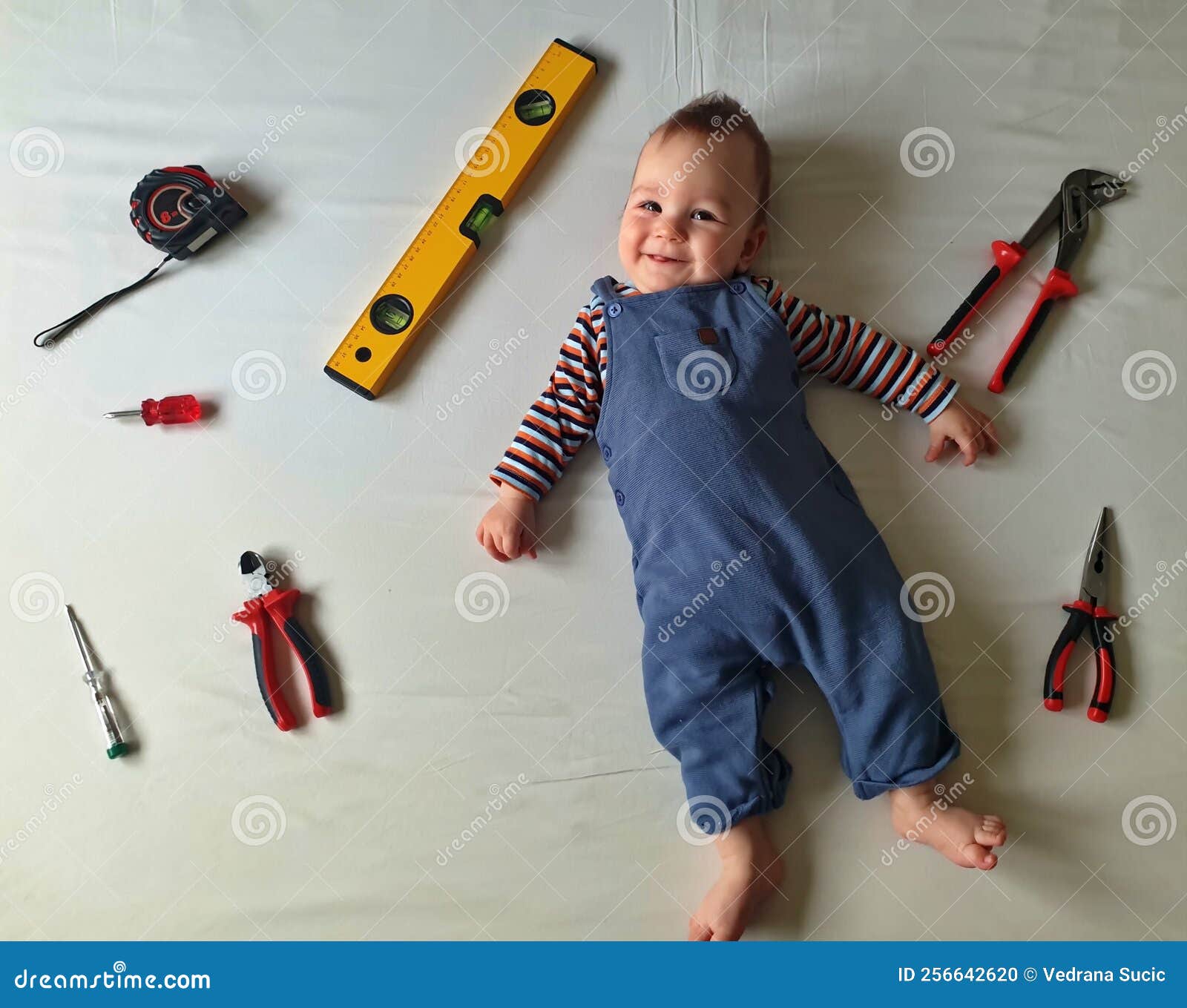Baby with mechanic tools stock photo. Image of equipment 256642620