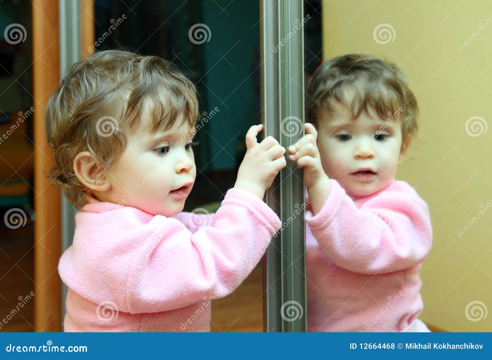Baby with mirror stock photo. Image of raincoat, sideways 12664468