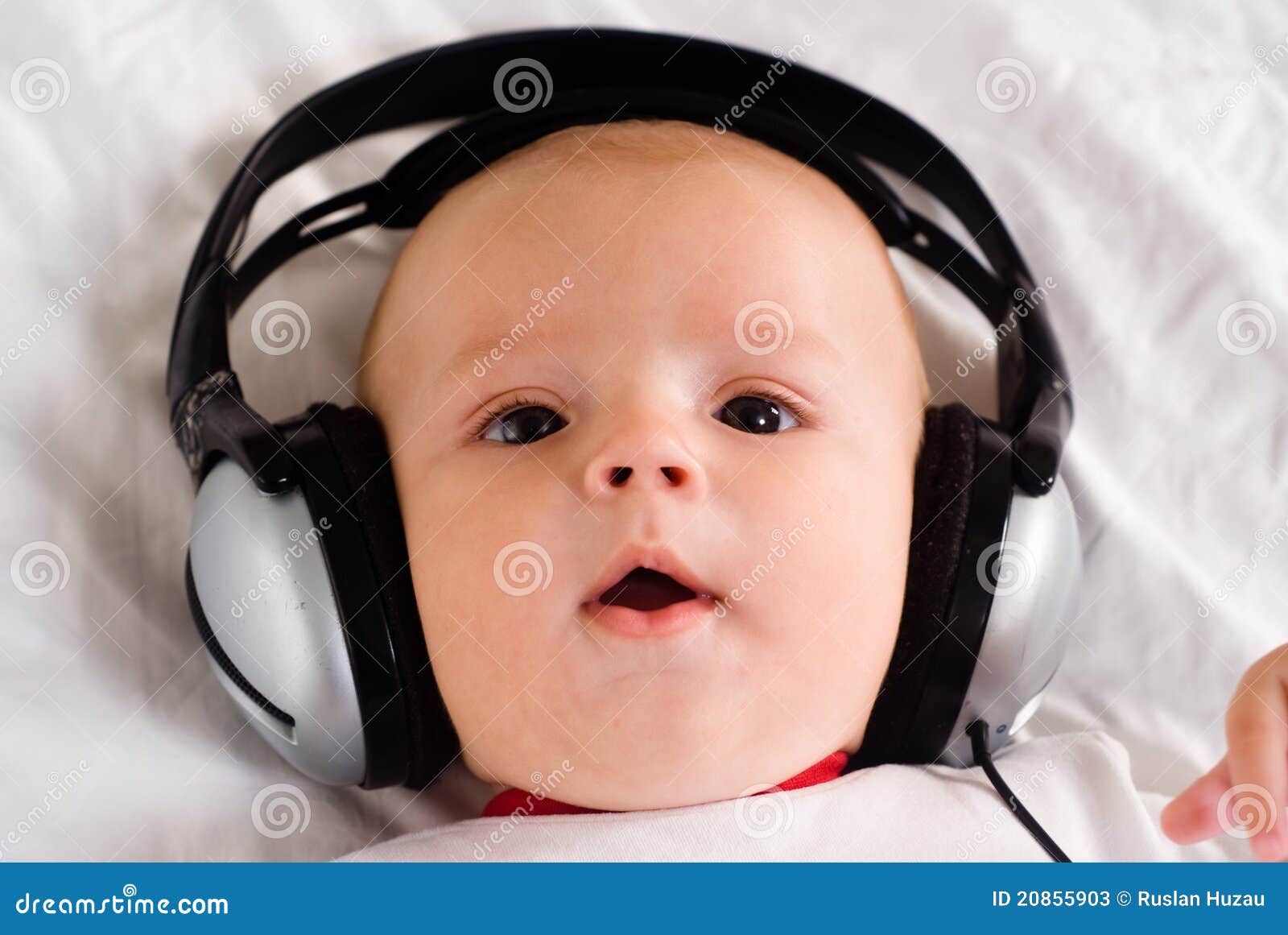 Baby music listening stock image. Image of smile, comfort 20855903