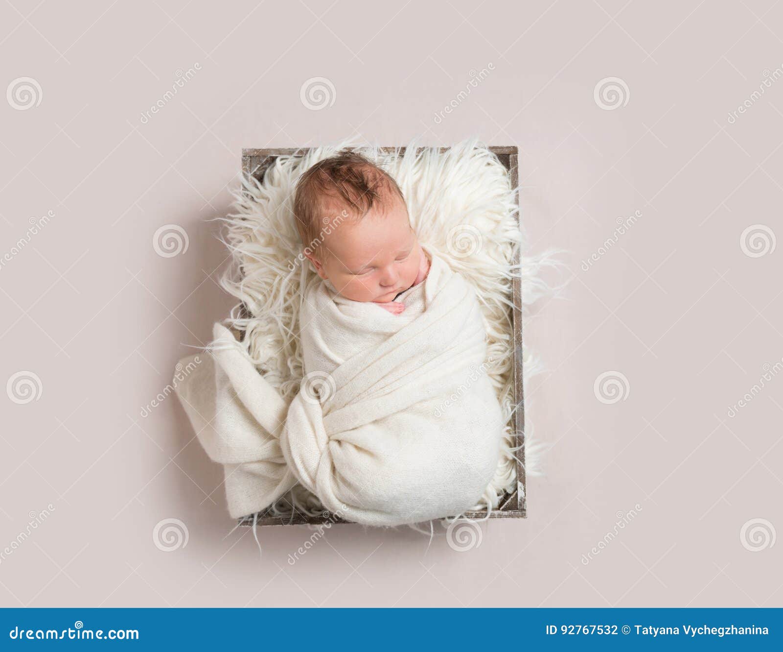 baby napping in basket , wrapped up, topview