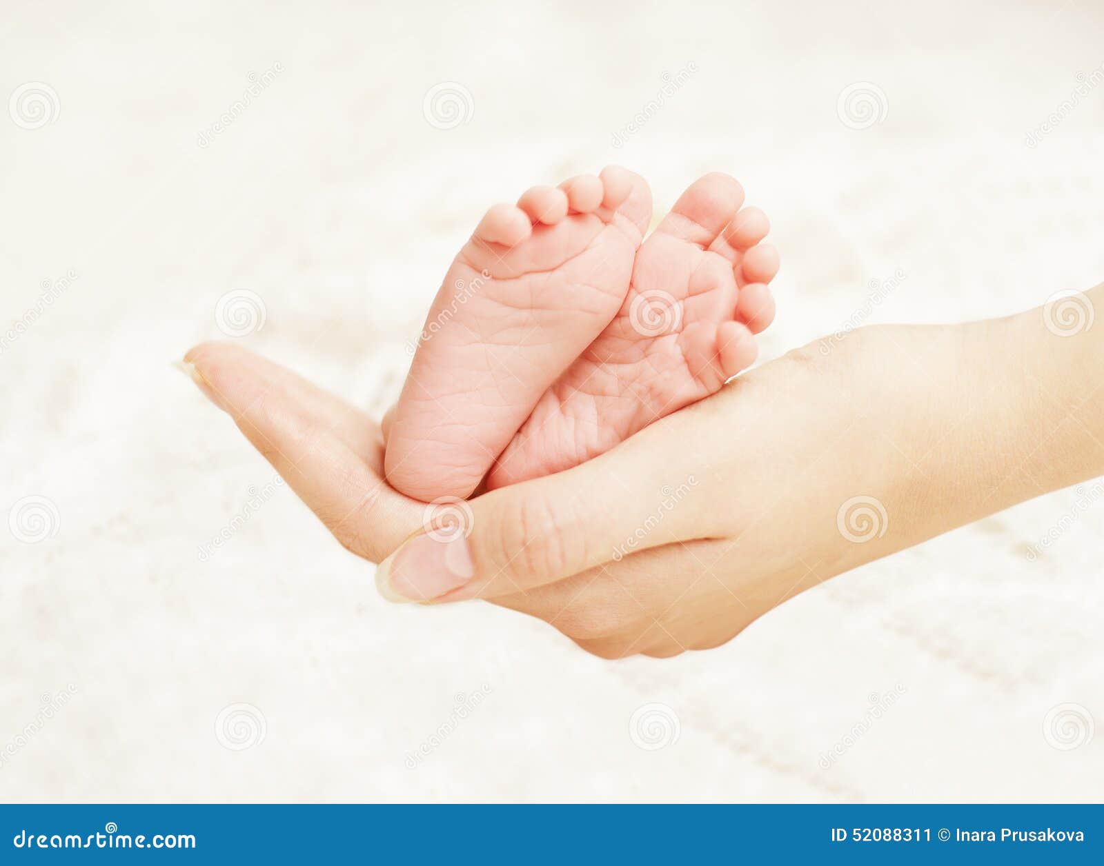 baby newborn feet mother hands. new born kid foot, family love