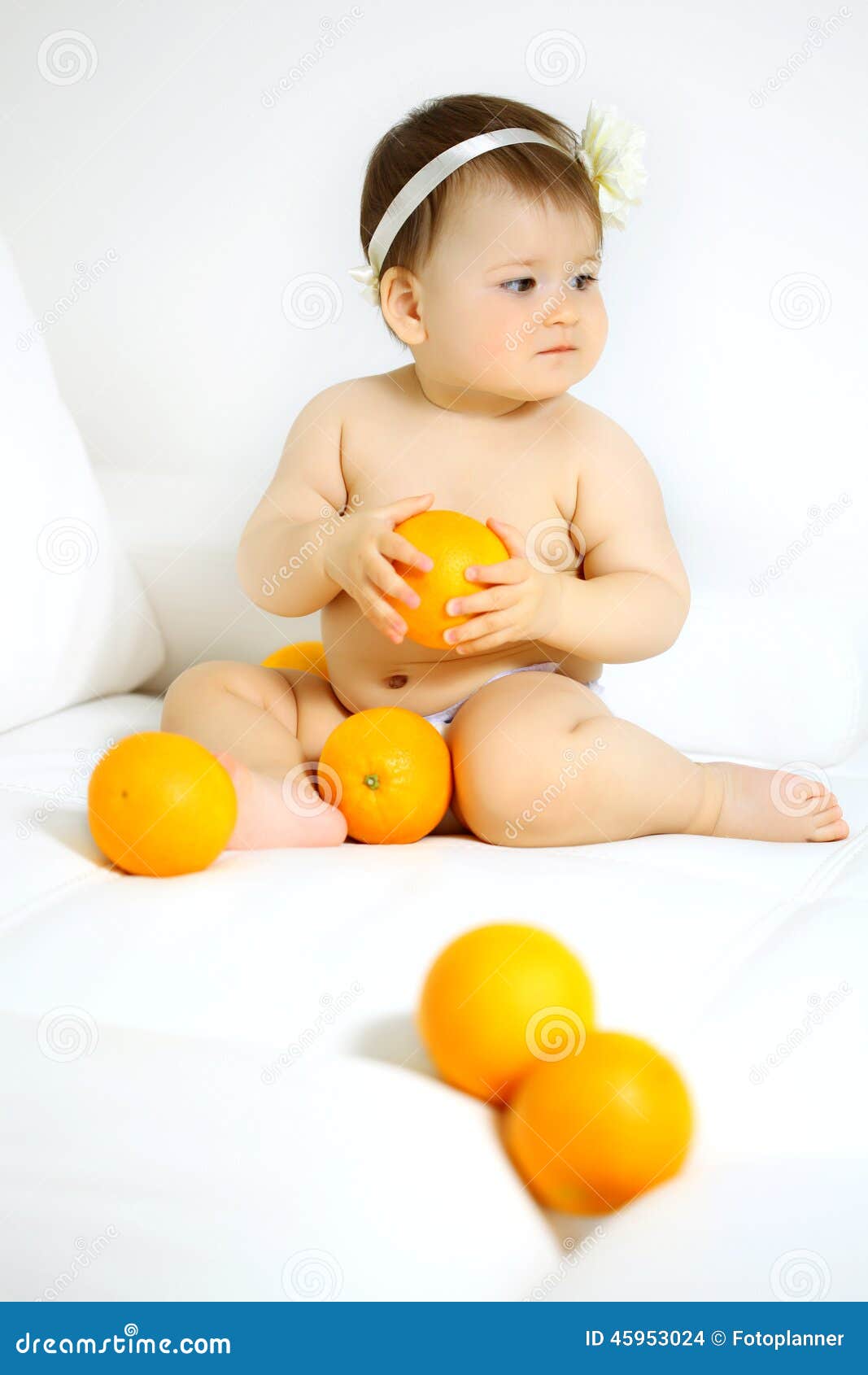 Baby with oranges stock photo. Image of cute, adorable 45953024