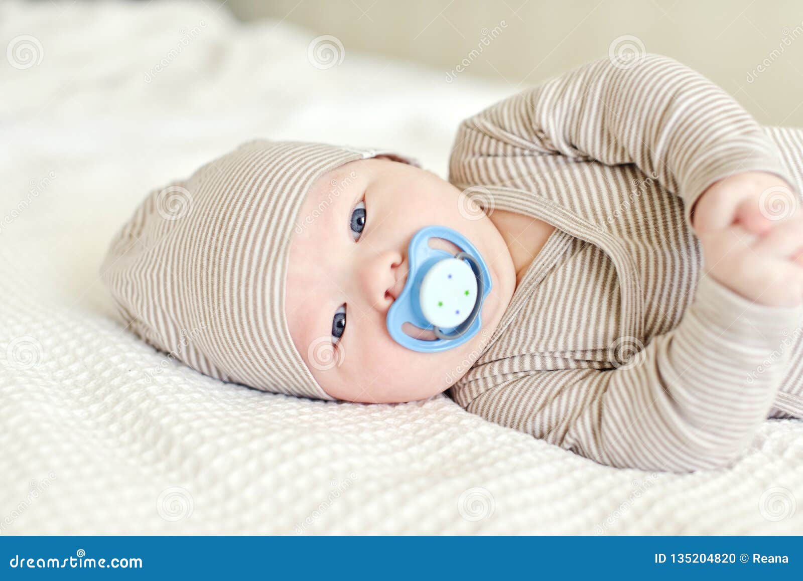Baby with pacifier stock photo. Image of isolated, baby 135204820
