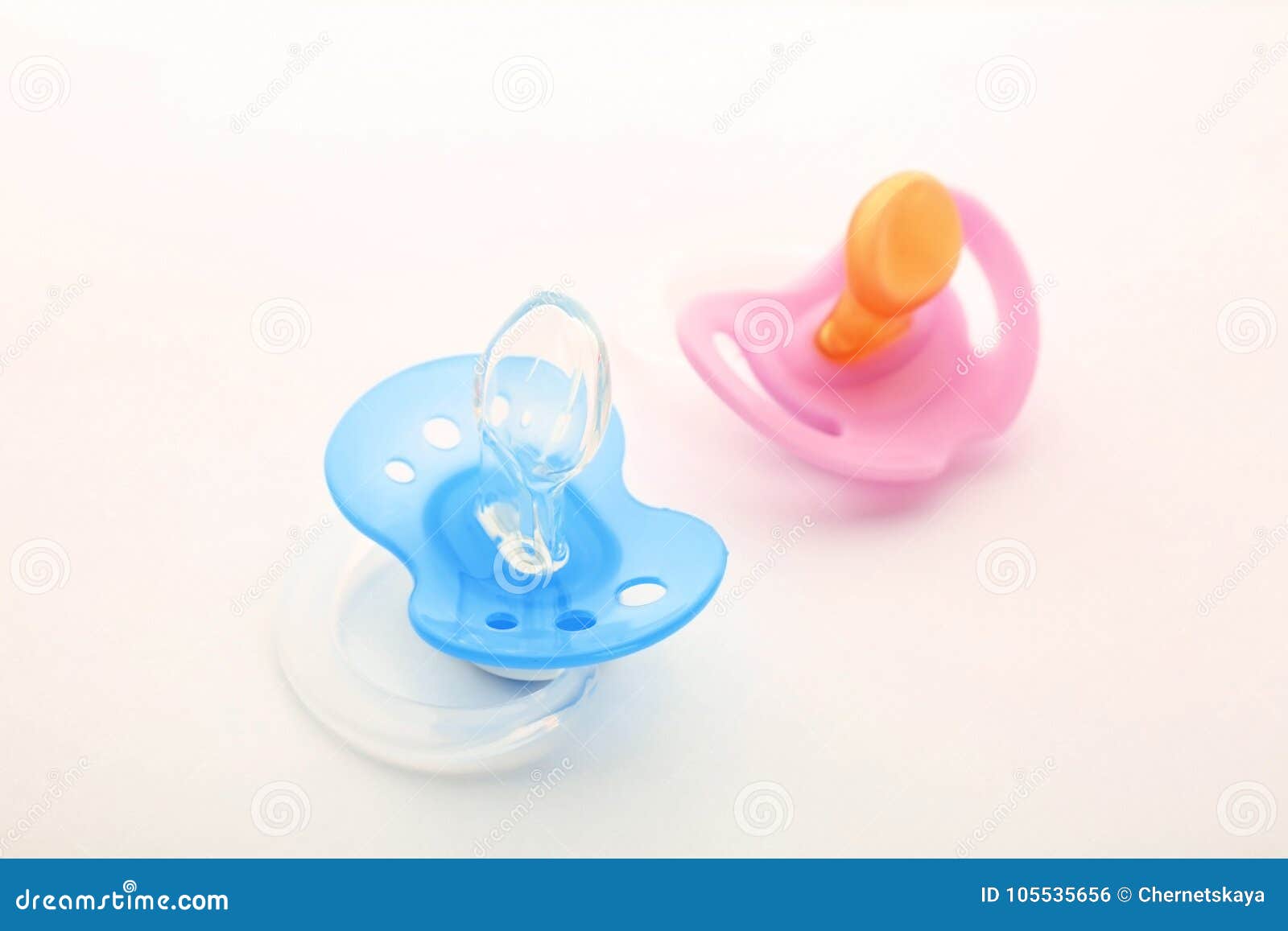 Baby pacifiers on white stock photo. Image of nipple - 105535656