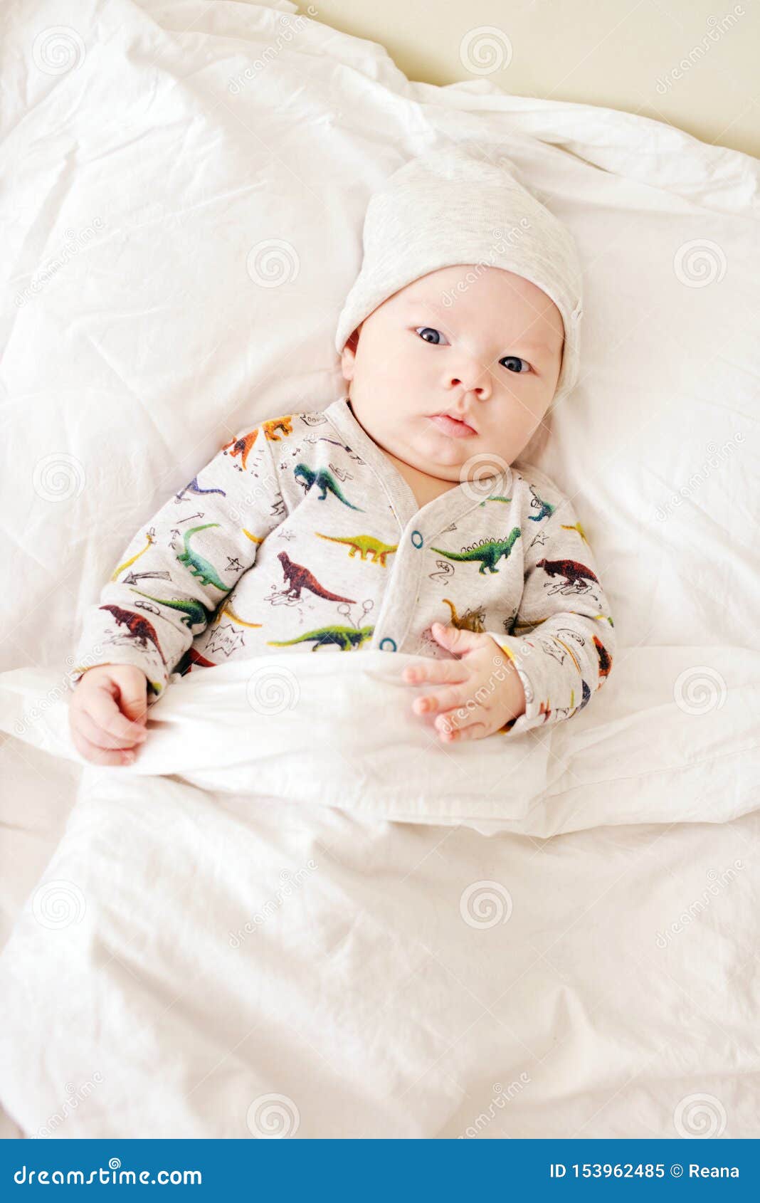 Baby on the parents bed stock image. Image of human 153962485