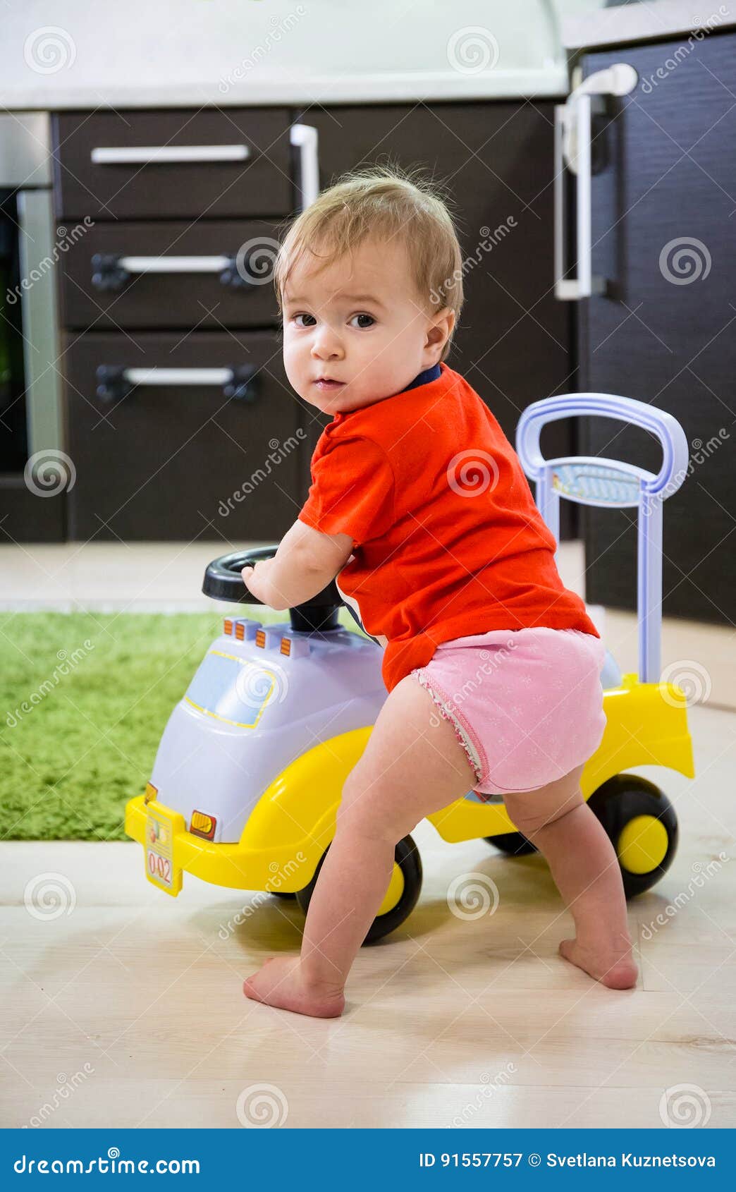 Baby playing with car stock image. Image of achievement 91557757