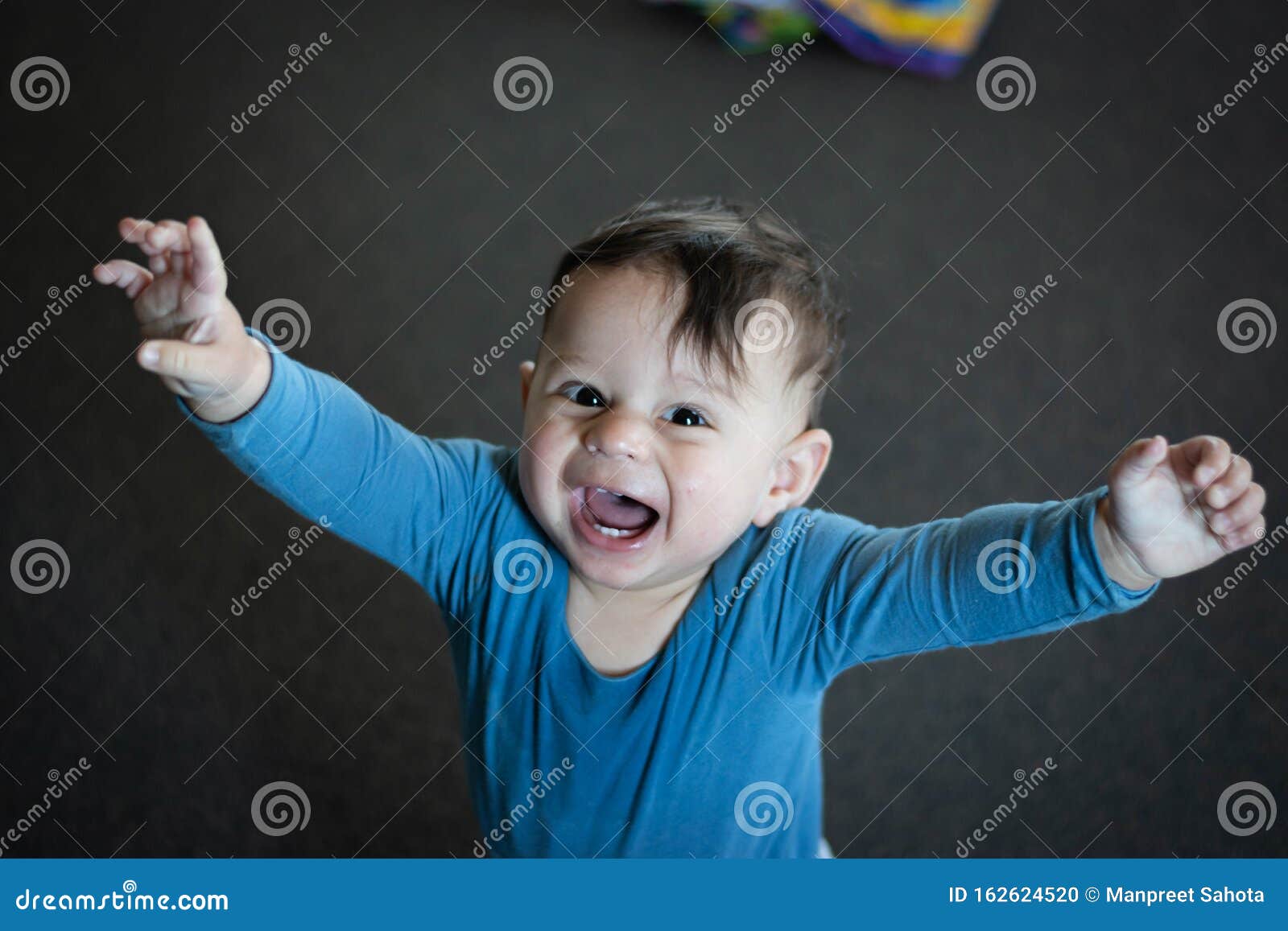 A Baby Playing on the Floor Stock Photo Image of enjoying, joyful