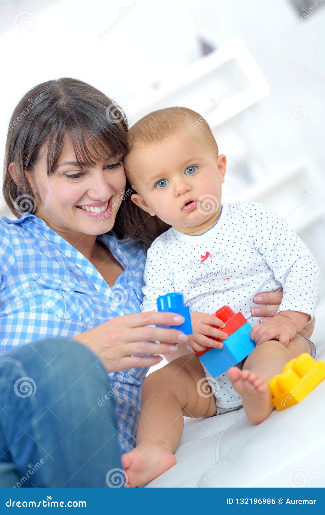 Baby playing lego with mum stock photo. Image of motherhood 132196986