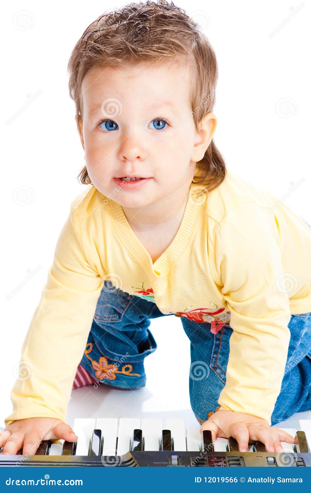 Baby playing the piano stock photo. Image of beautiful 12019566