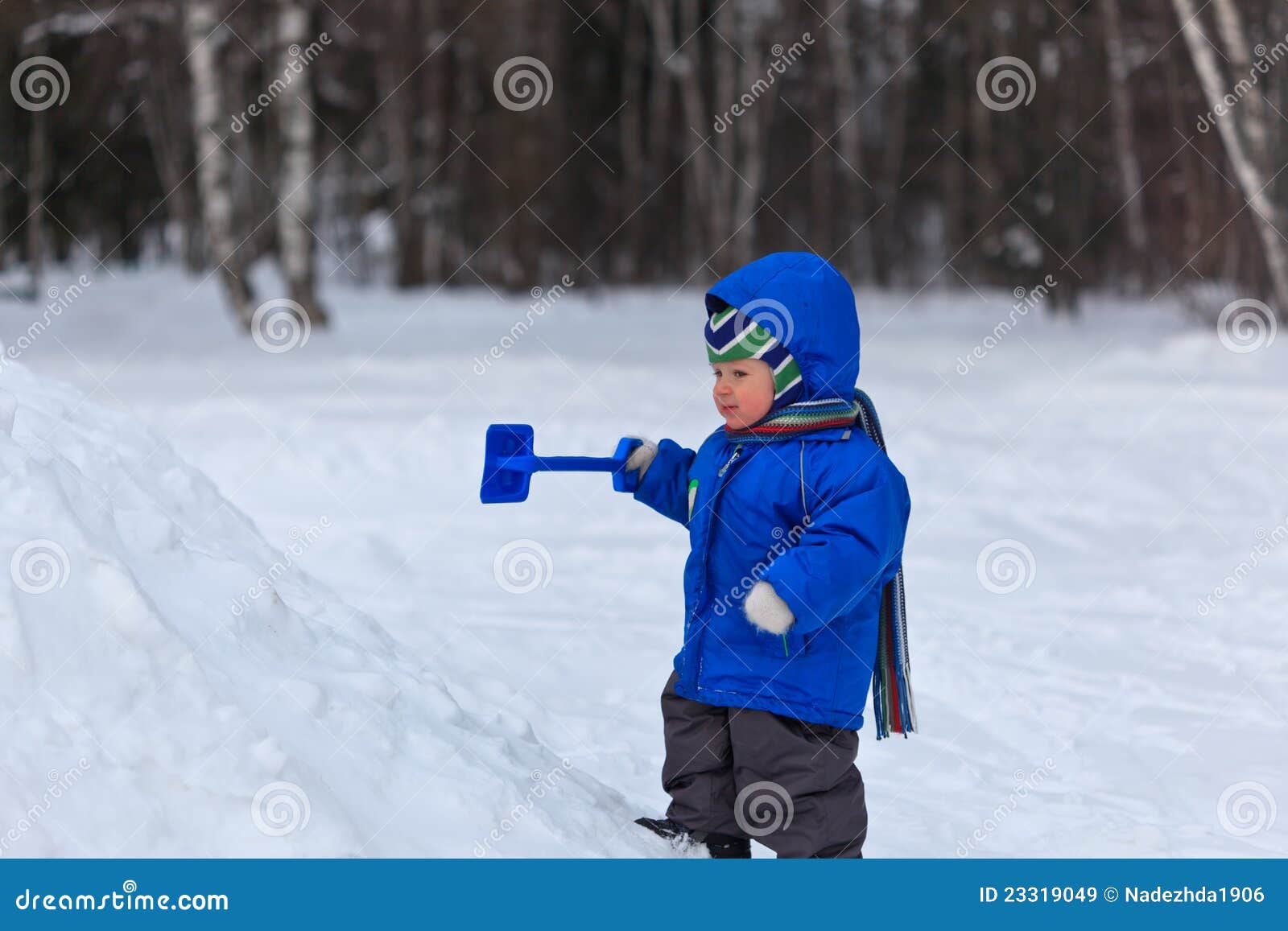 Baby playing in snow stock image. Image of branch, cool 23319049