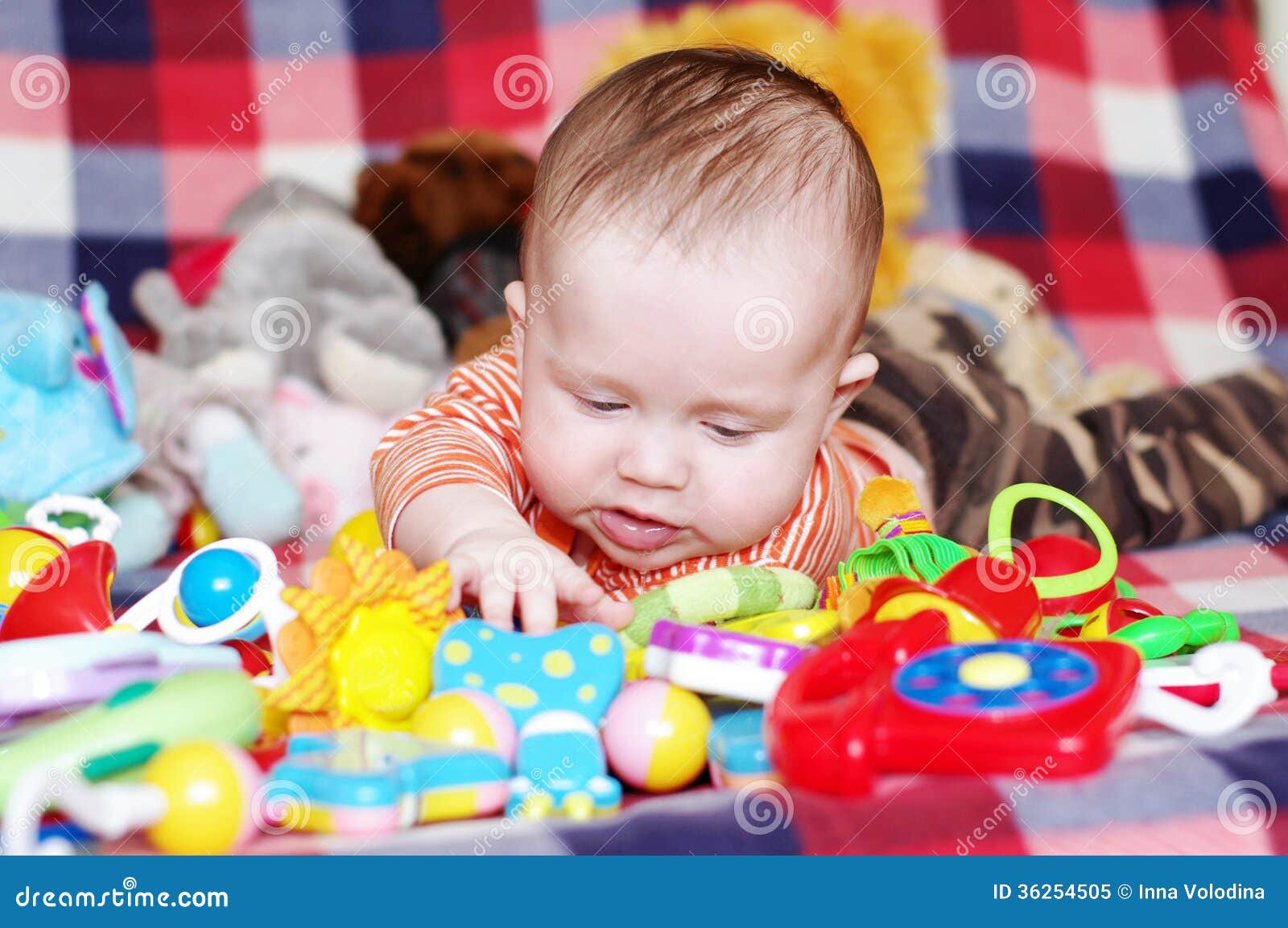 Baby playing toys stock image. Image of amusing, rattle 36254505