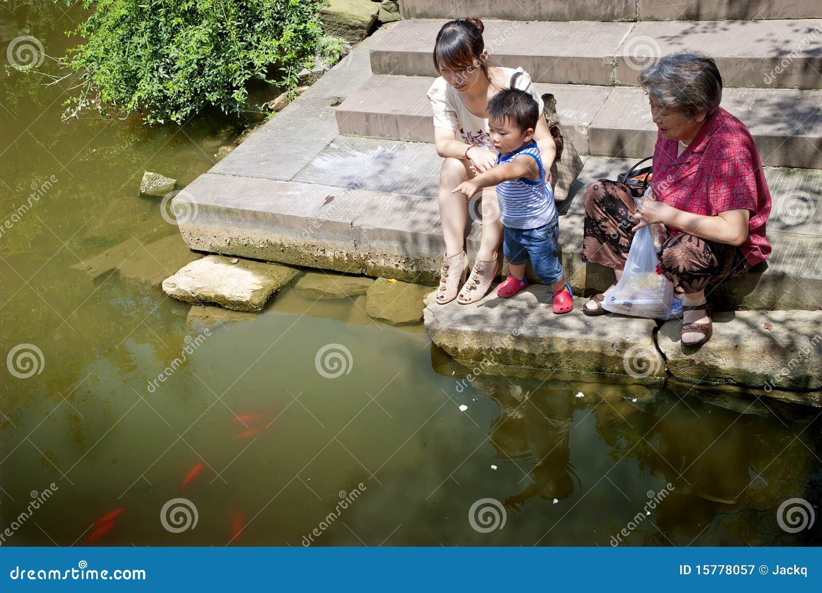 baby playing at the waterside