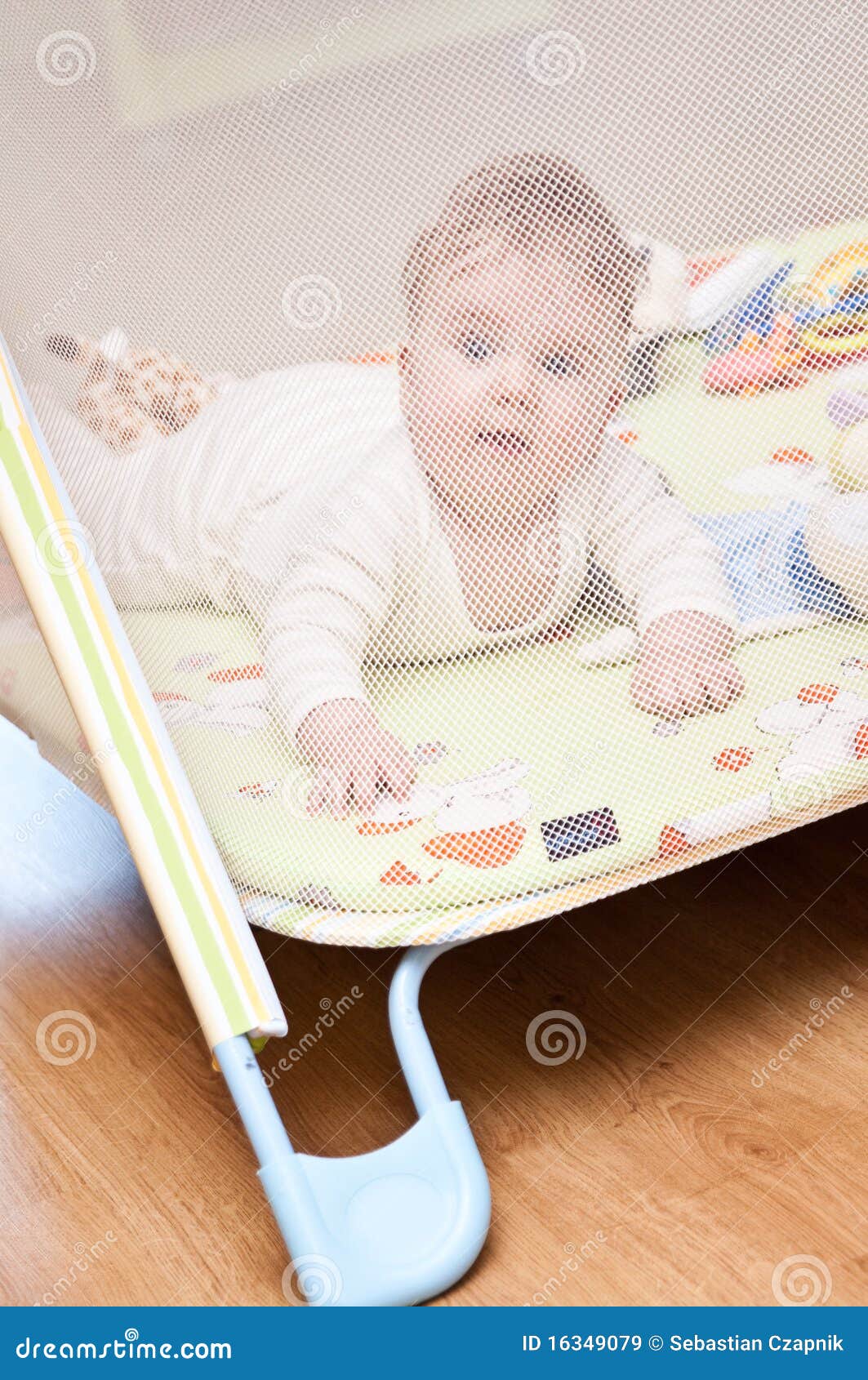 Baby in playpen stock image. Image of small, play, mesh 16349079