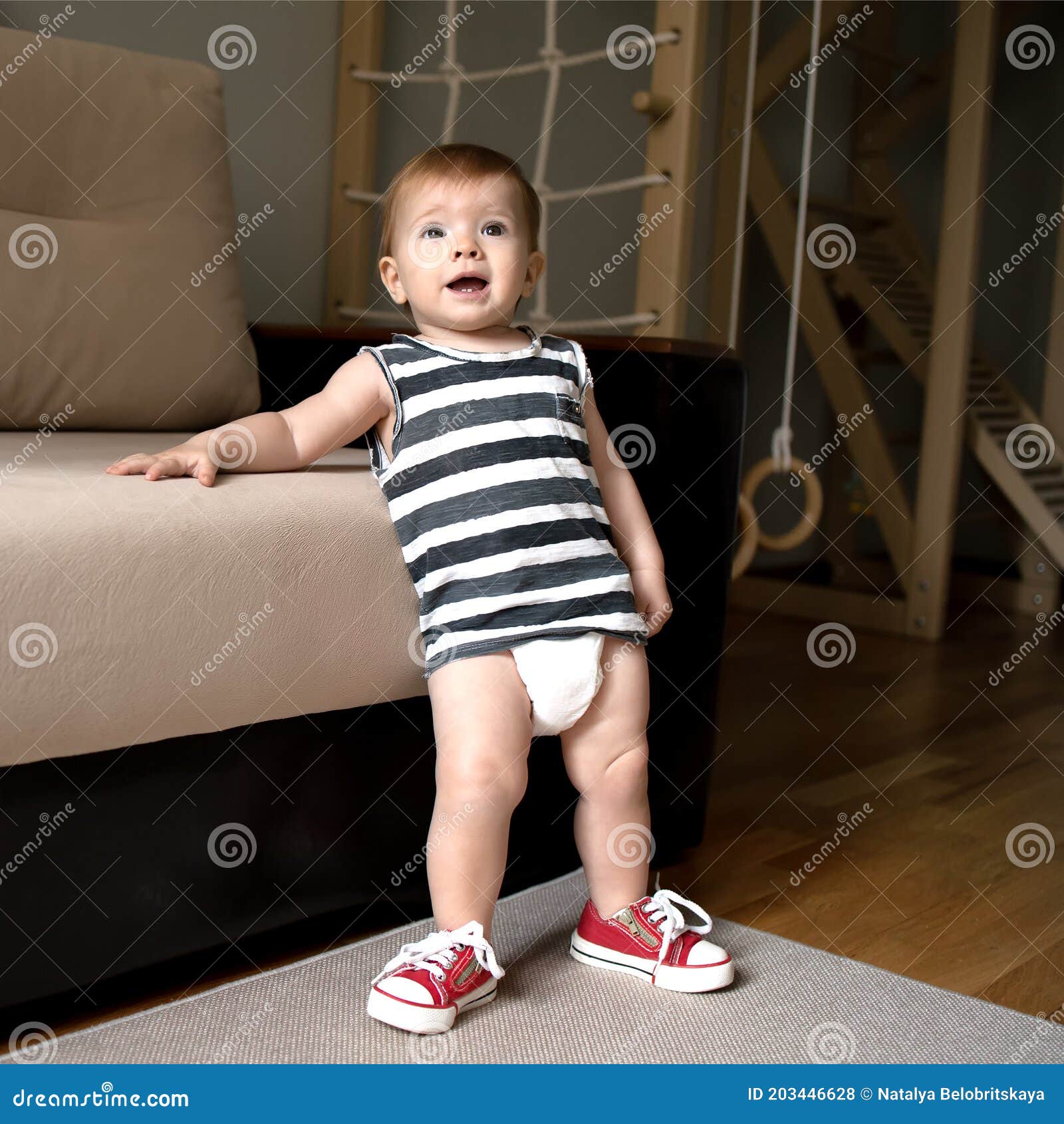 Baby Plays Sports at Home, Baby`s in a Diaper. Close Up Stock Photo ...