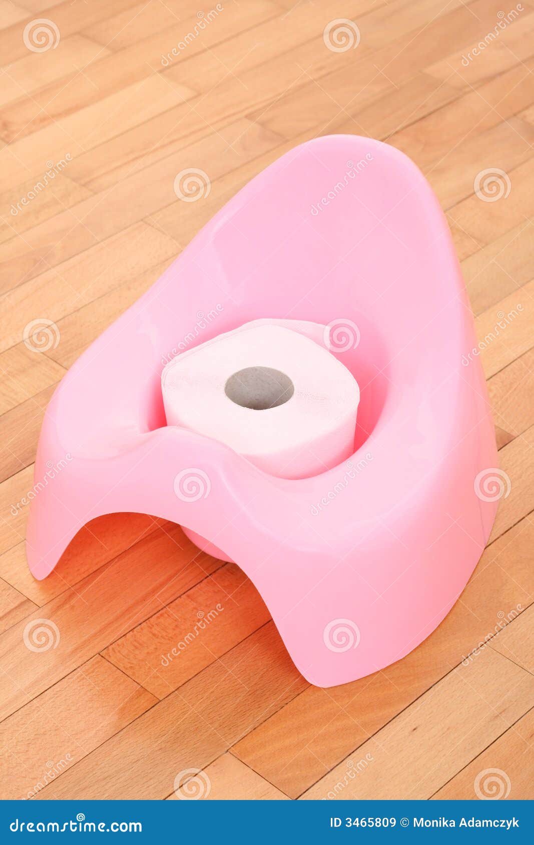 The Child Sits On A White Toilet. In His Hands Is Toilet 