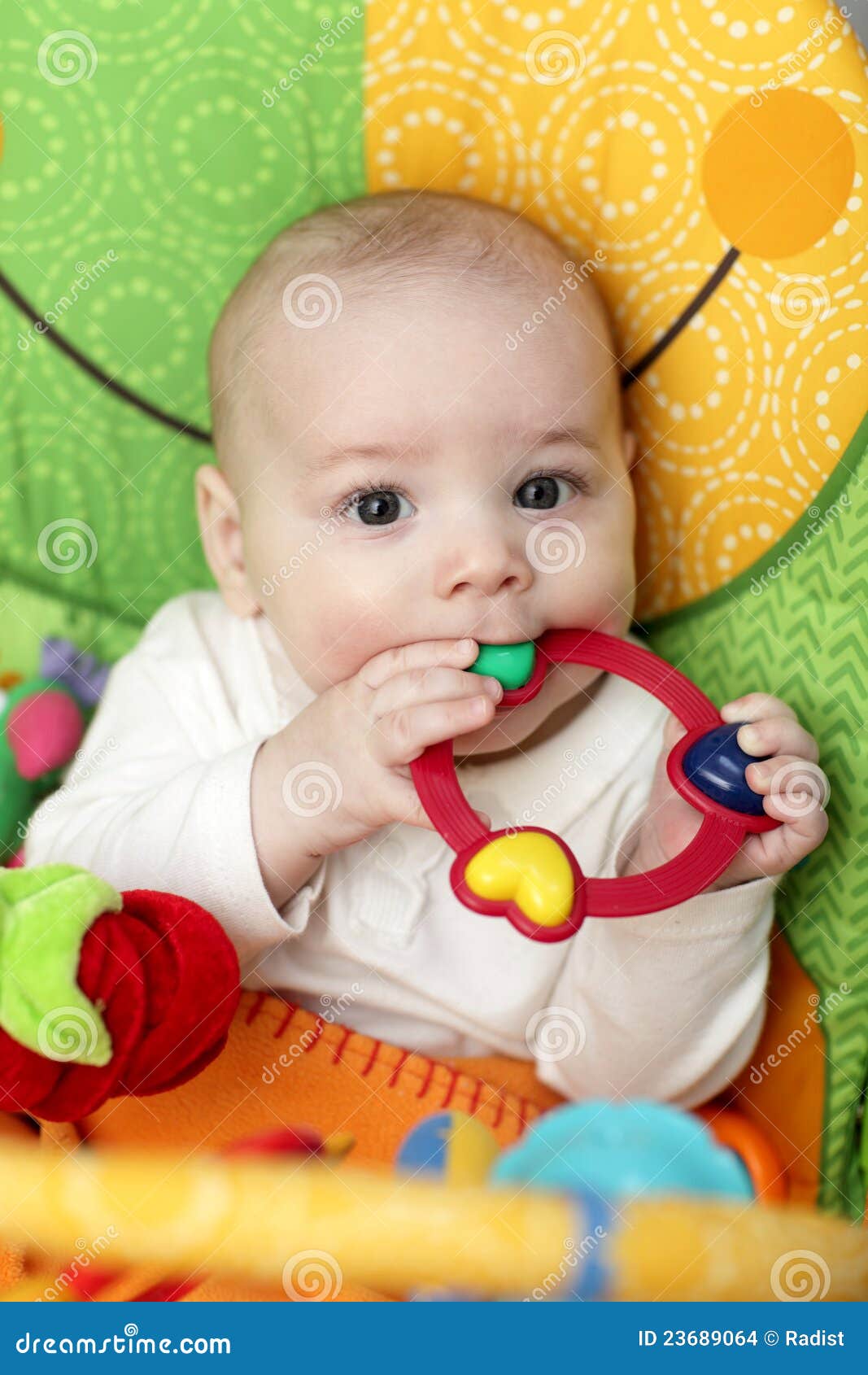 Baby with rattle ring stock photo. Image of curiosity 23689064