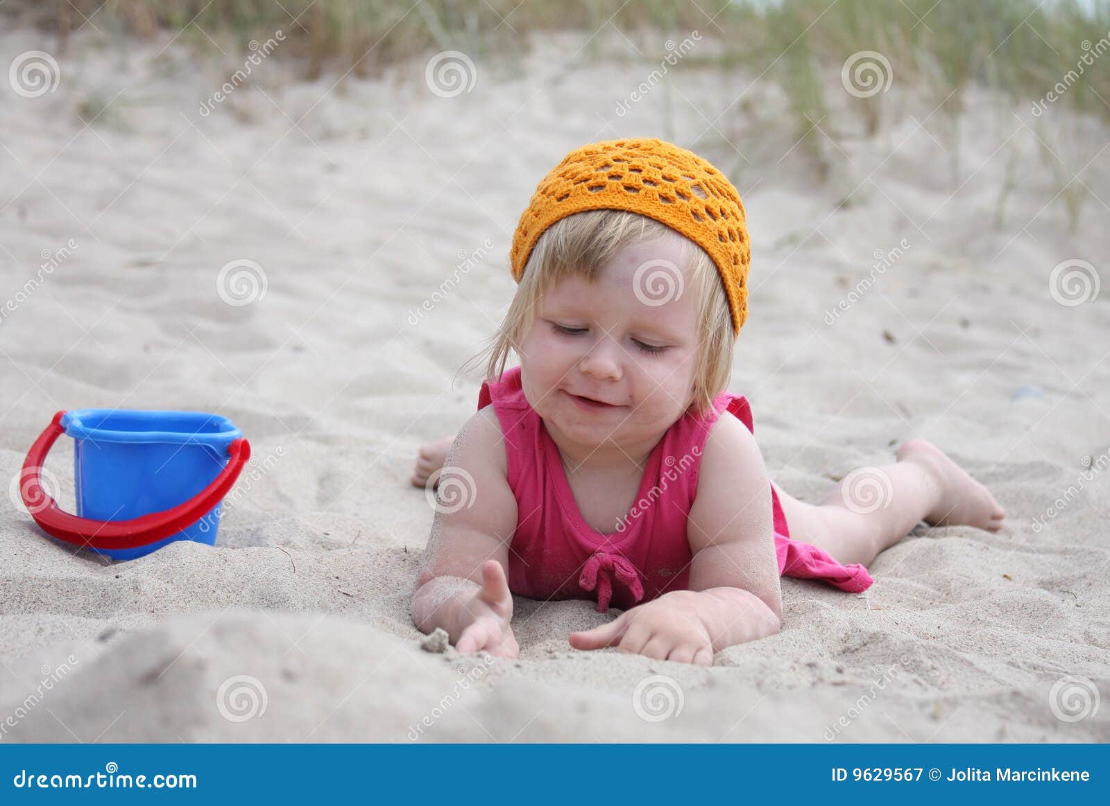 Baby on sand stock image. Image of midday, beige, playing 9629567