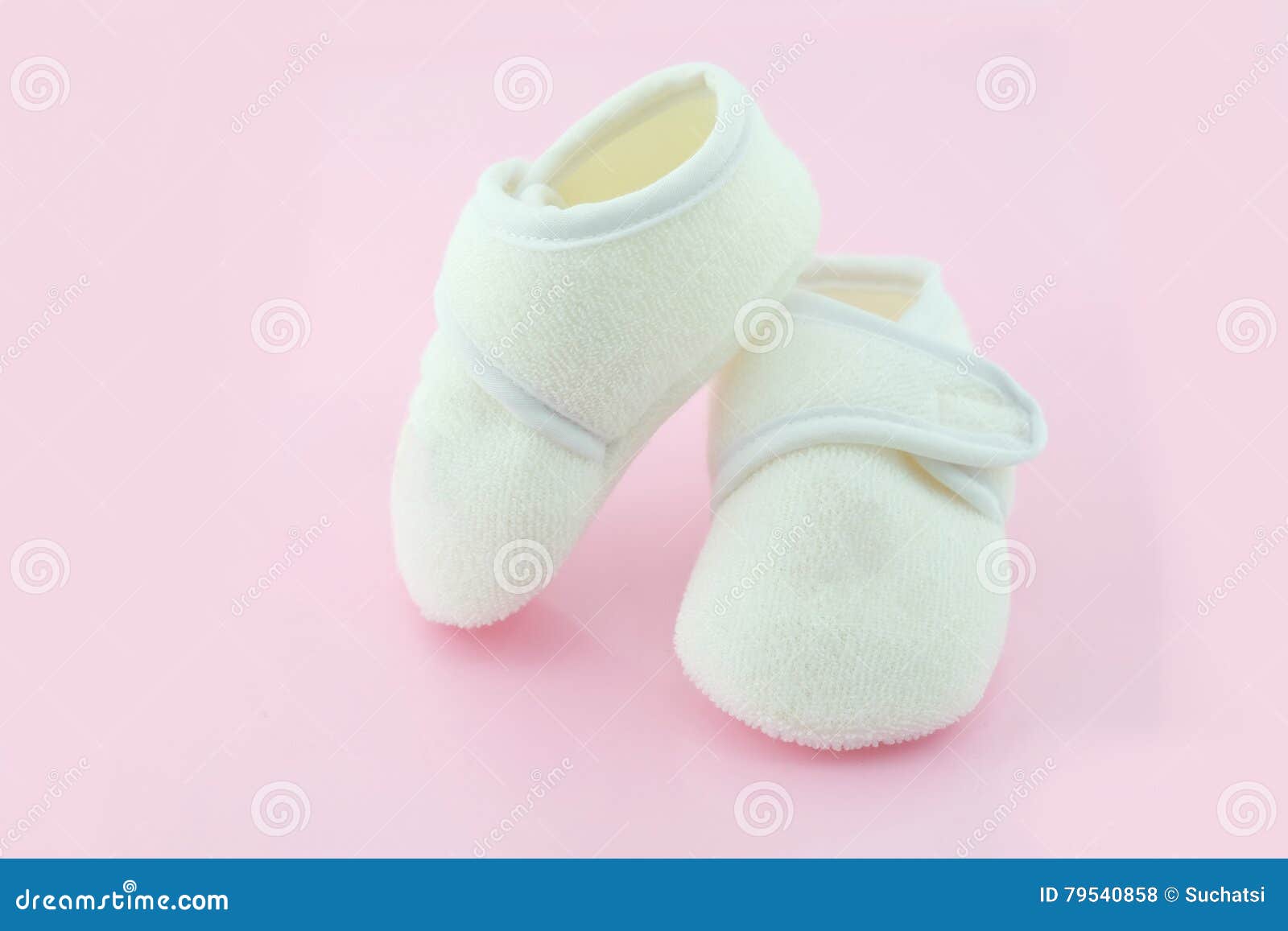 Baby shoes on light pink stock photo. Image of pink, young 79540858