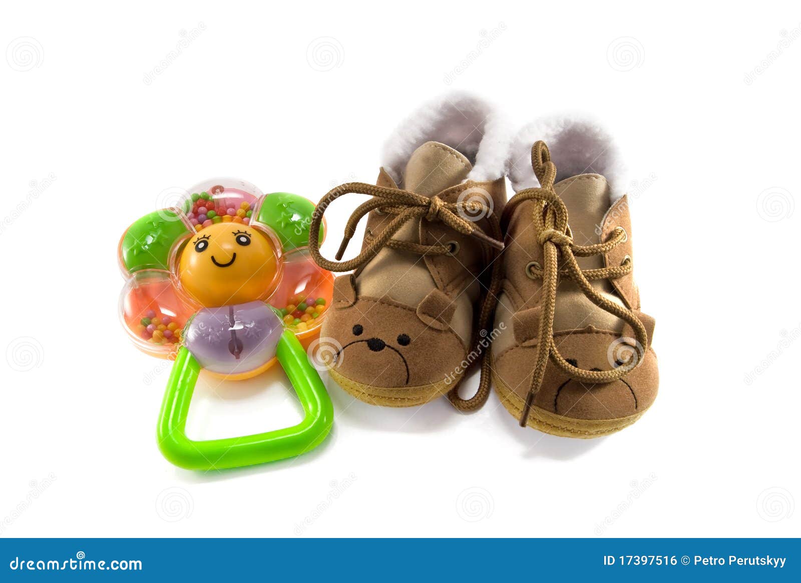 Baby shoes and rattle stock photo. Image of small, plastic 17397516