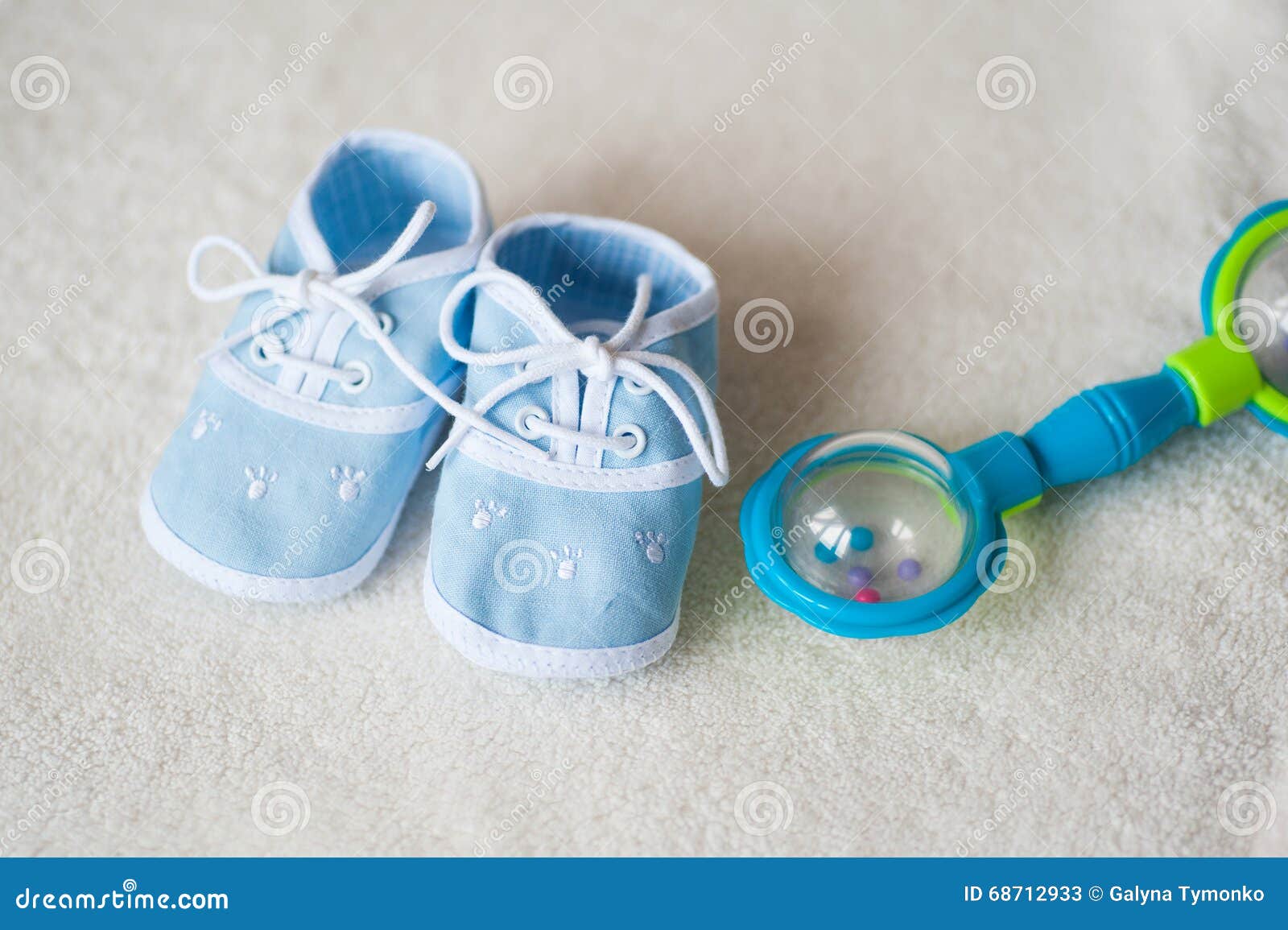 Baby Shoes and Rattle on Light Background Stock Image Image of soothe