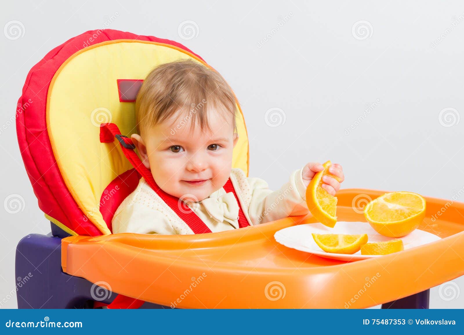 Baby Sits in Highchair with Orange. Stock Image Image of hungry, baby