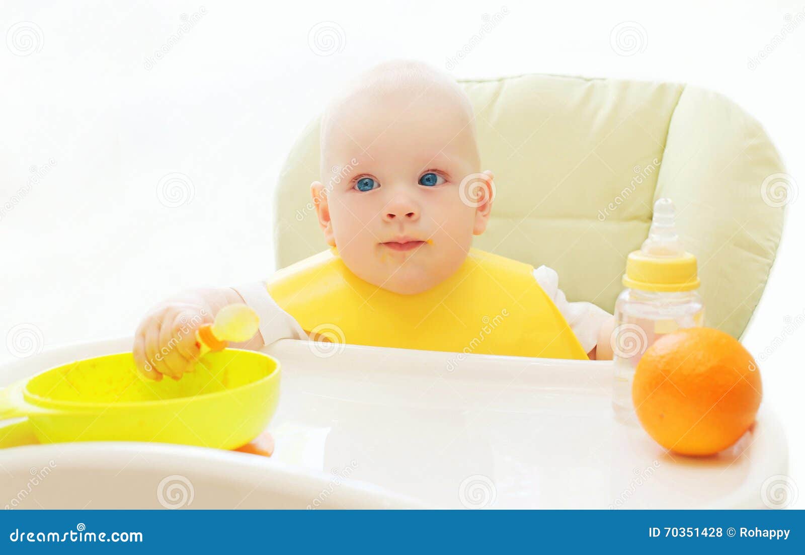 Baby Sitting at Table Home and Eats Spoon Stock Photo Image of care