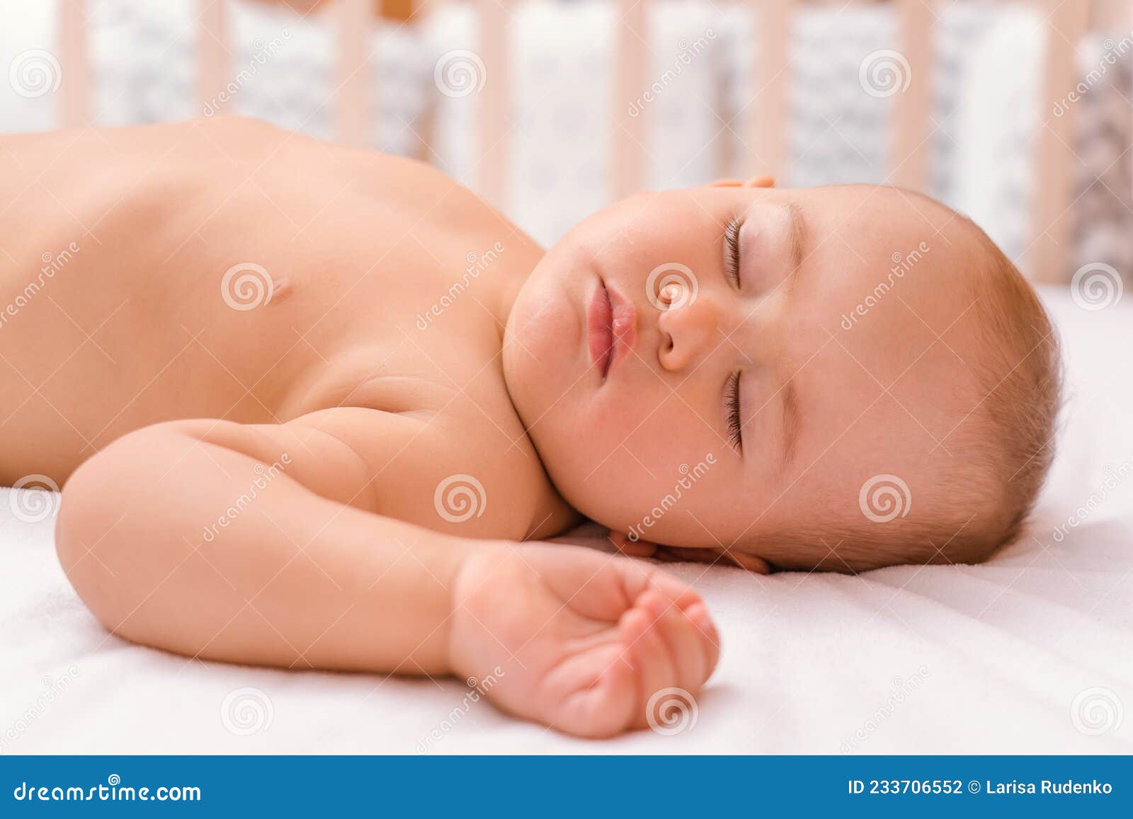 The Baby is Sleeping on the Bed, a Closeup Portrait. Sleep Time Stock