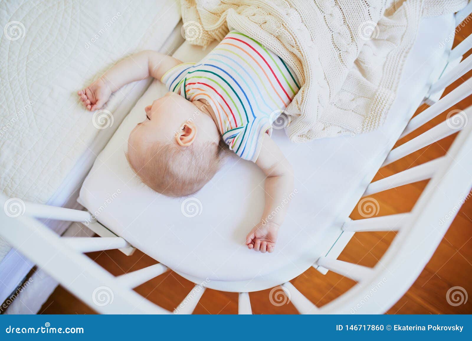 Baby Sleeping In Co-sleeper Crib Attached To Parents` Bed ...