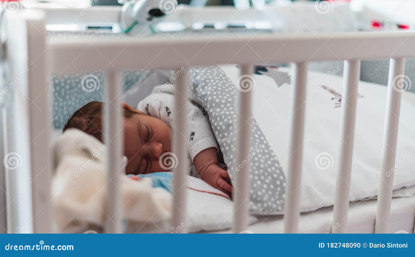 Baby sleeping in his bed stock photo. Image of little 182748090