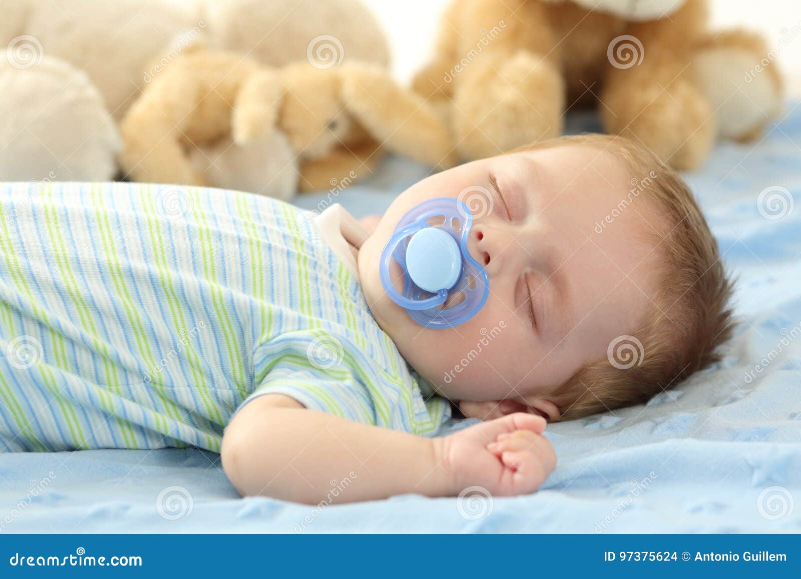 baby sleeping with a pacifier