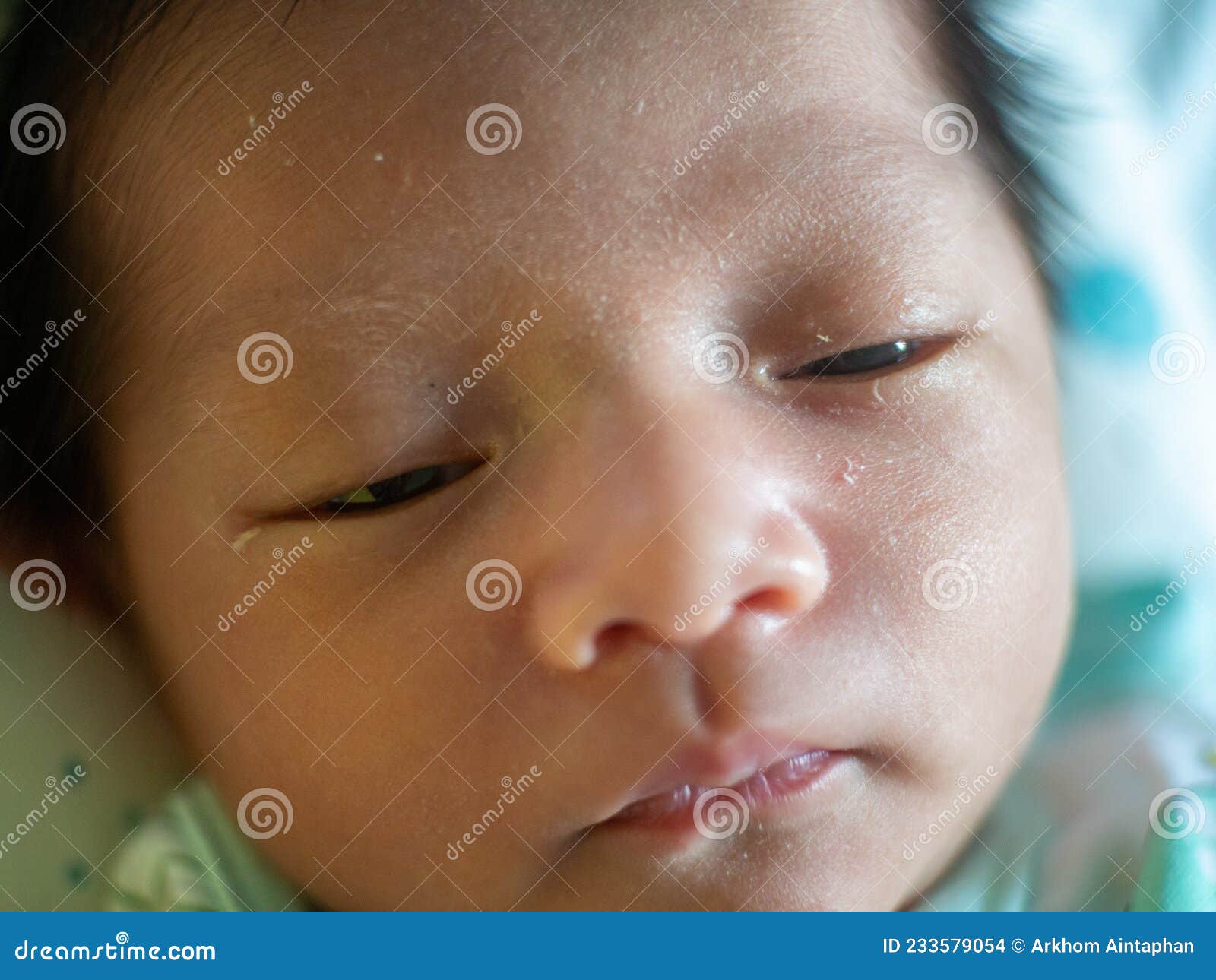 baby sleeping on mattress