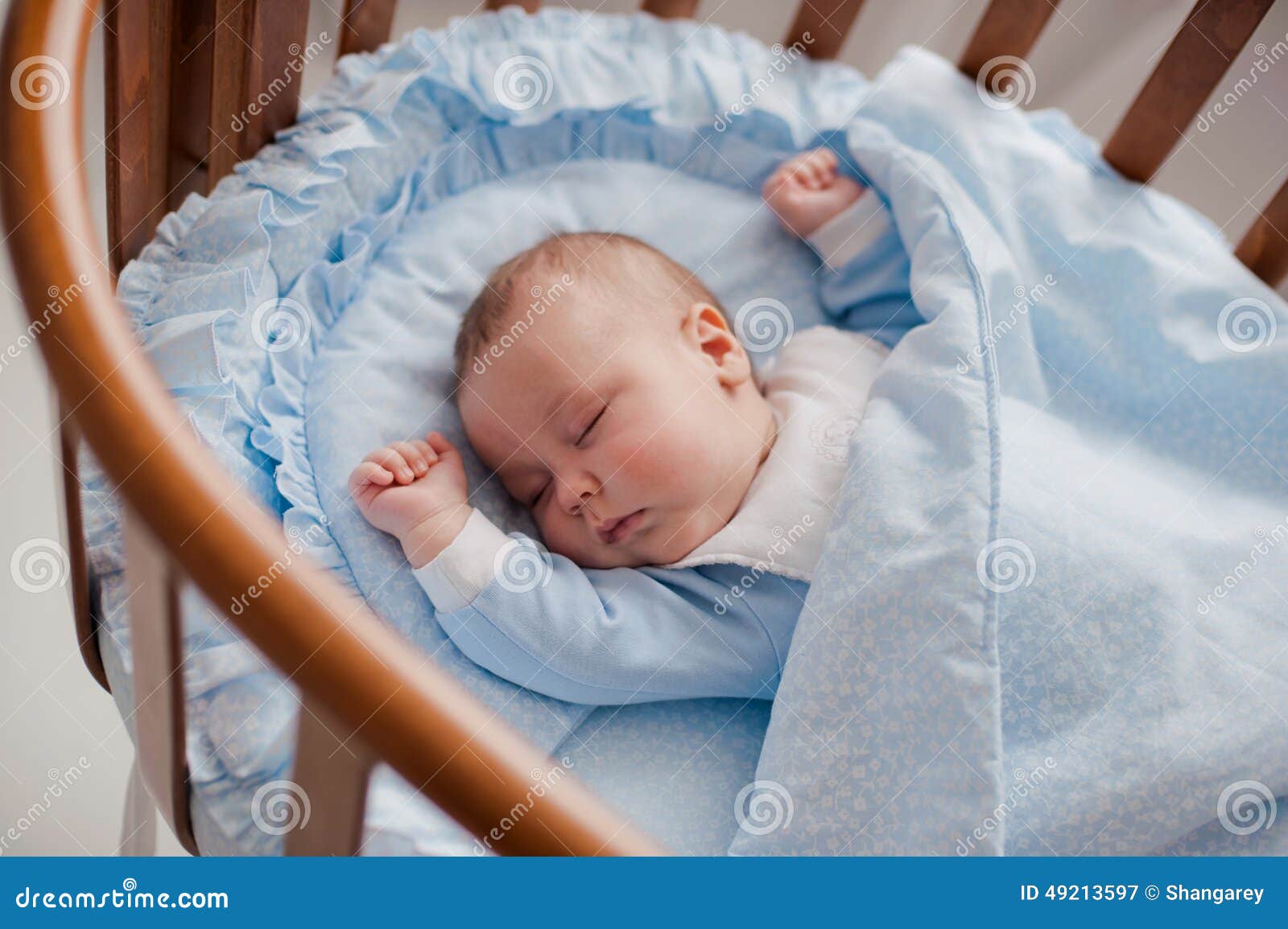 baby sleeps with a cradle