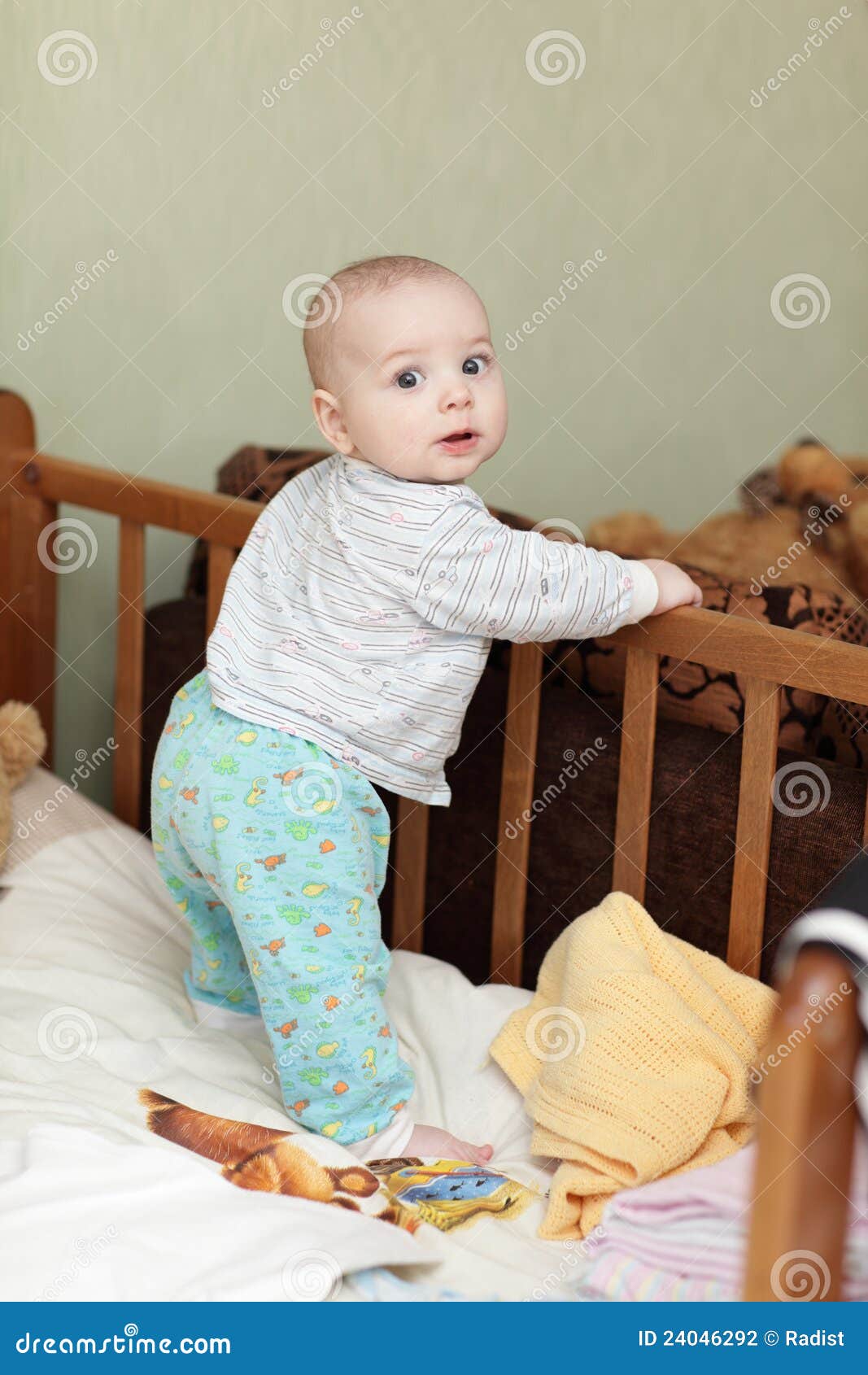 Baby standing in cot stock photo. Image of offspring 24046292