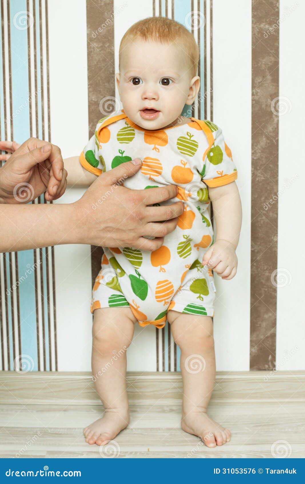 Baby is standing with help stock photo. Image of help ...