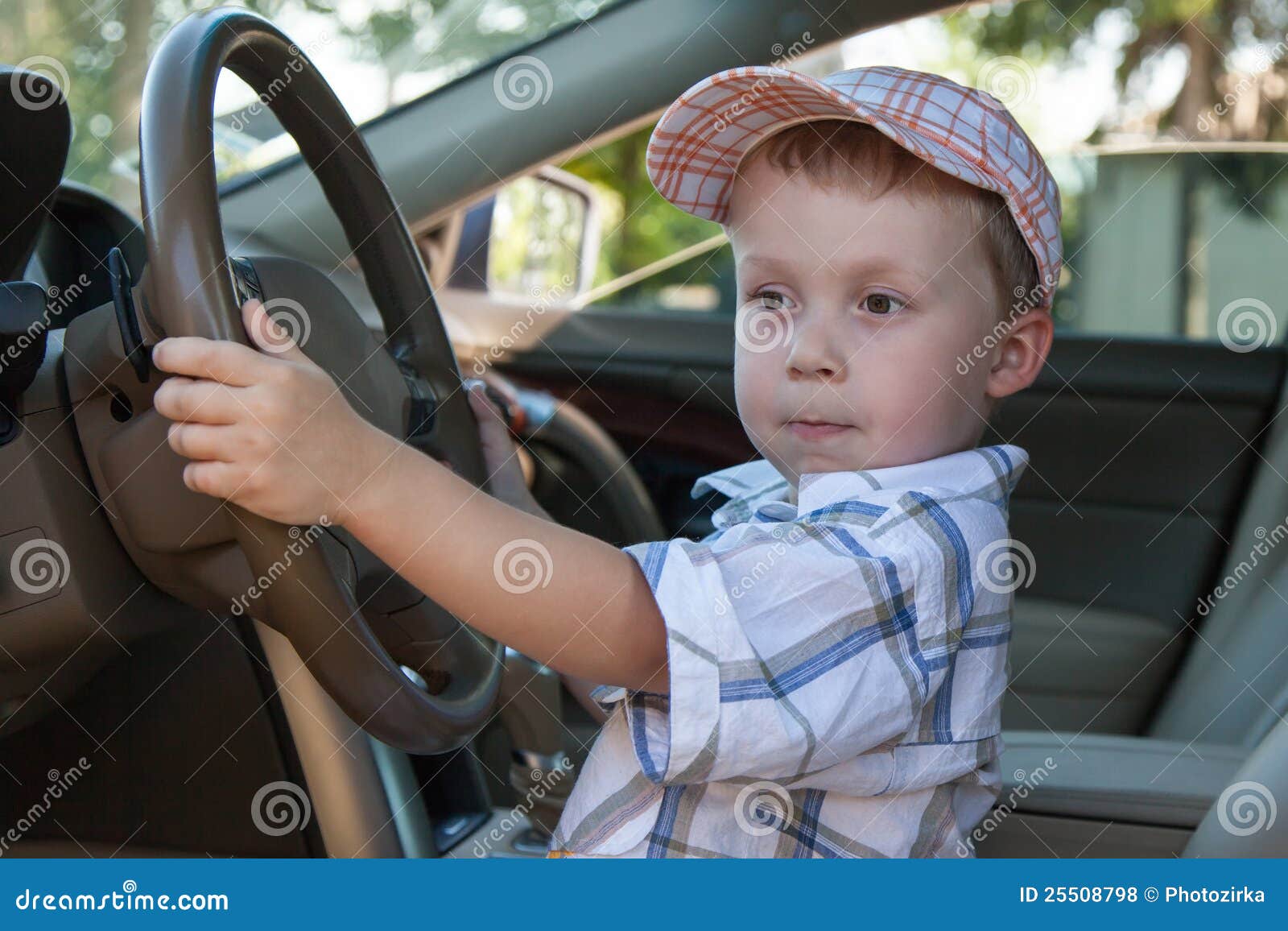 The baby at steering wheel stock photo. Image of activity 25508798