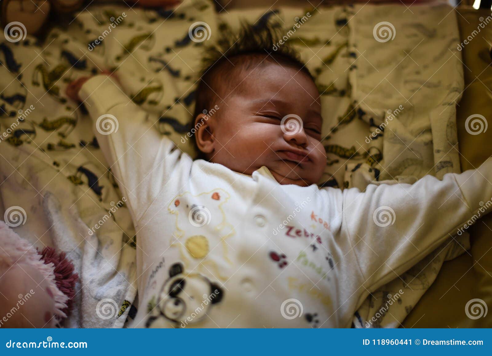 Baby stretching in crib. stock image. Image of family 118960441
