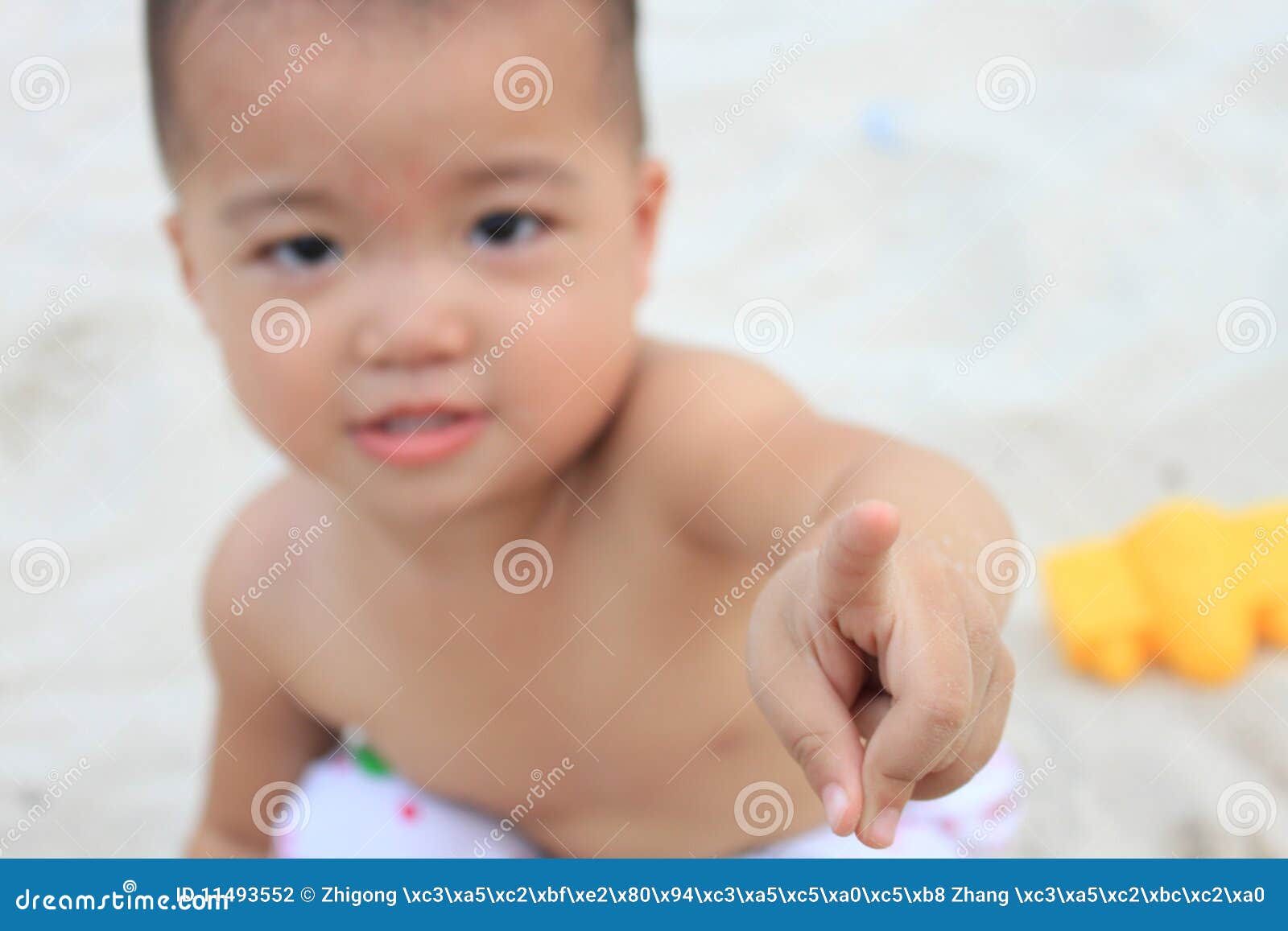 Asian Looking Down Nude - Baby Stretching Out Index Finger,focus On Finger Stock Photo ...