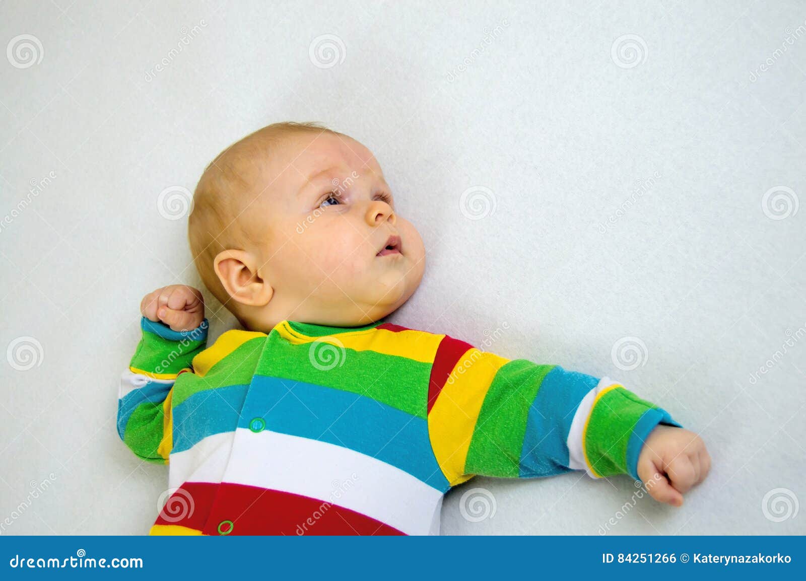 Baby in Striped Suit Lying on a Light Blanket Stock Photo Image of