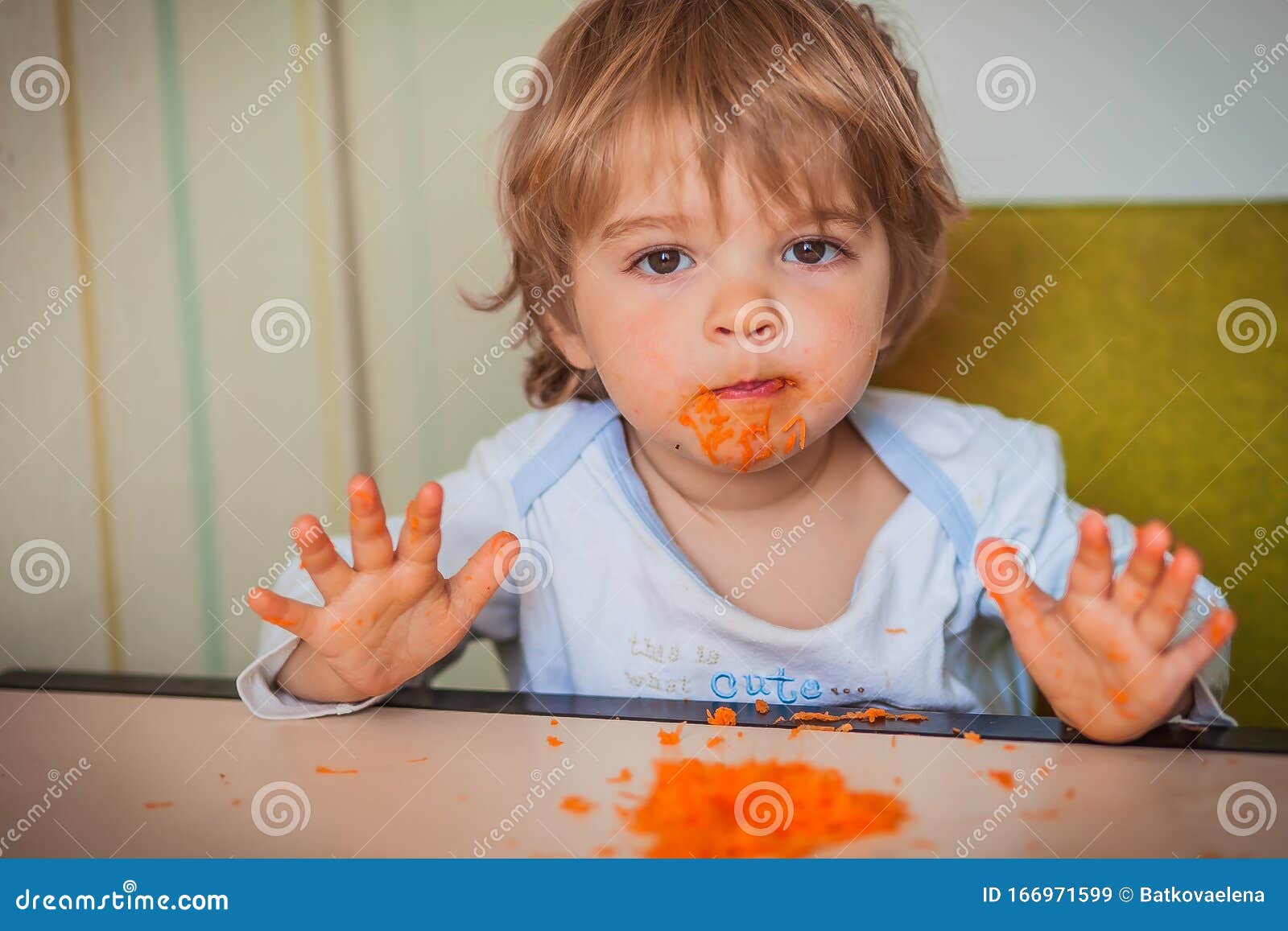 Baby Toddler Eats Carrots with Bare Hands Stock Image Image of face
