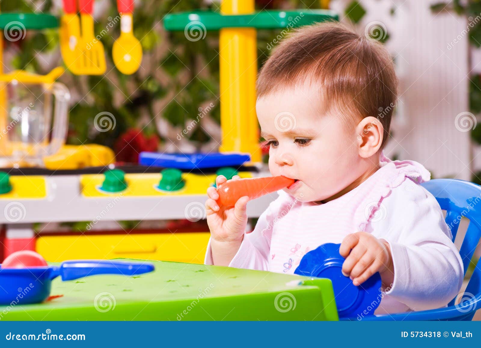 Baby and toy kitchen 2 stock photo. Image of people, eating 5734318