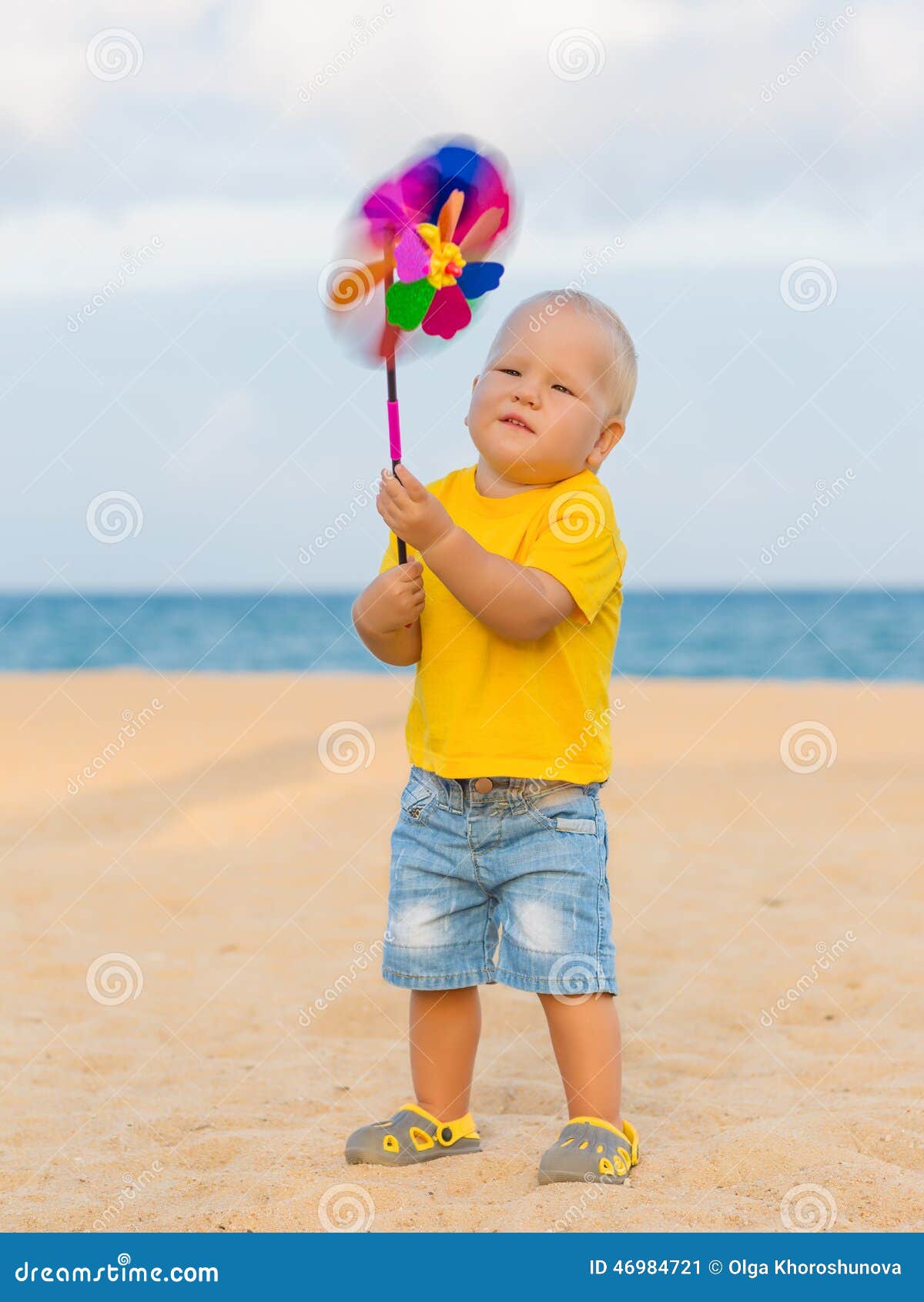 Baby with toy windmill stock image. Image of conceptual 46984721