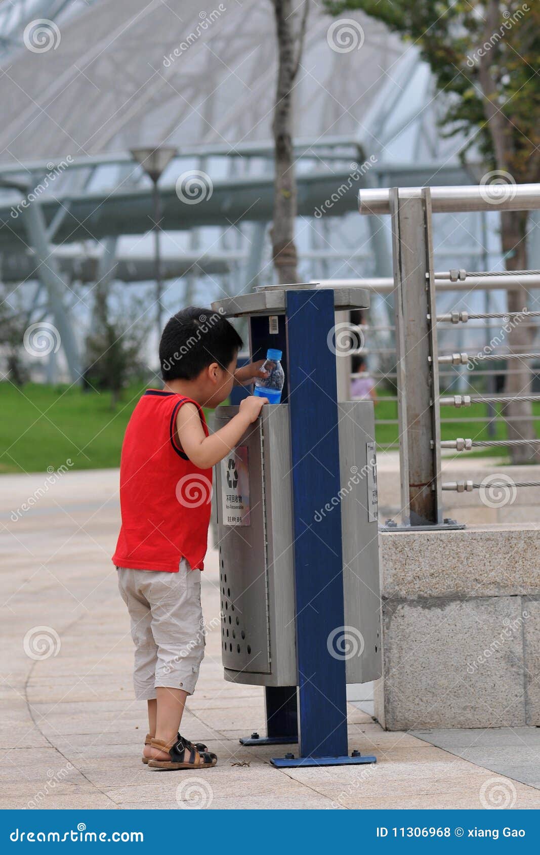 Baby and trash can stock photo. Image of plastic, yelloe 11306968