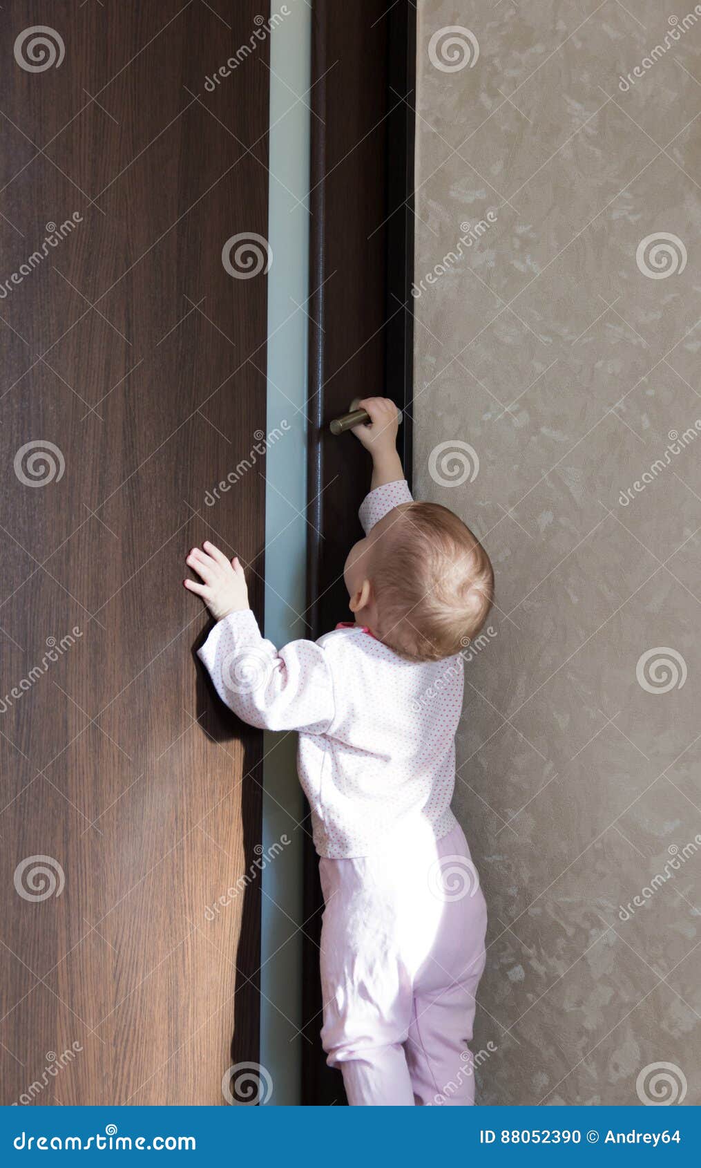 Baby Tries To Open the Door Stock Photo Image of exit, door 88052390