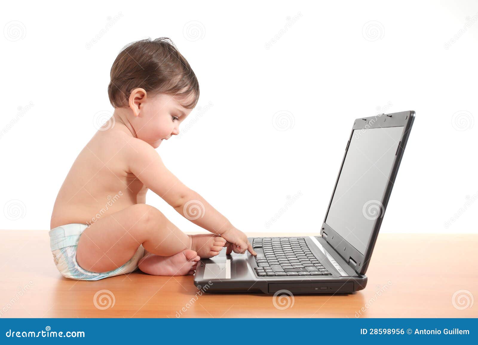 Baby Typing On A Laptop Computer Keyboard Stock Photo Baby Typing On A Laptop Computer Keyboard Stock Photo