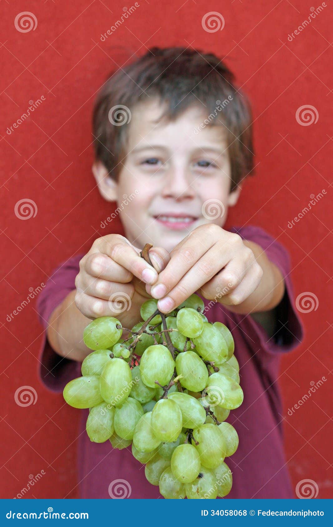 Baby Who Kindly Offers Grapes Stock Photo Image of grapes, young