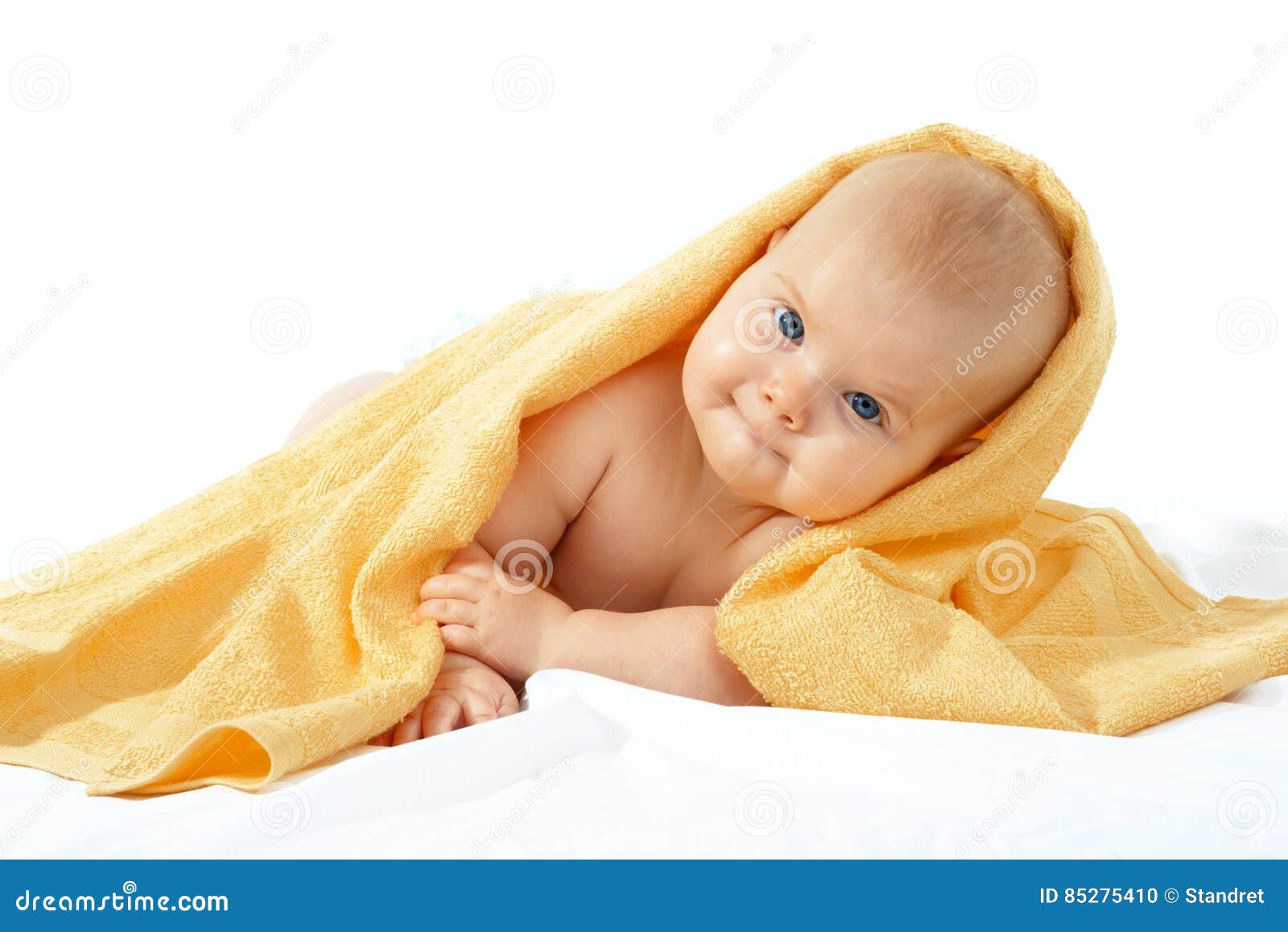 Baby in yellow towel stock photo. Image of closeup, nursing - 85275410